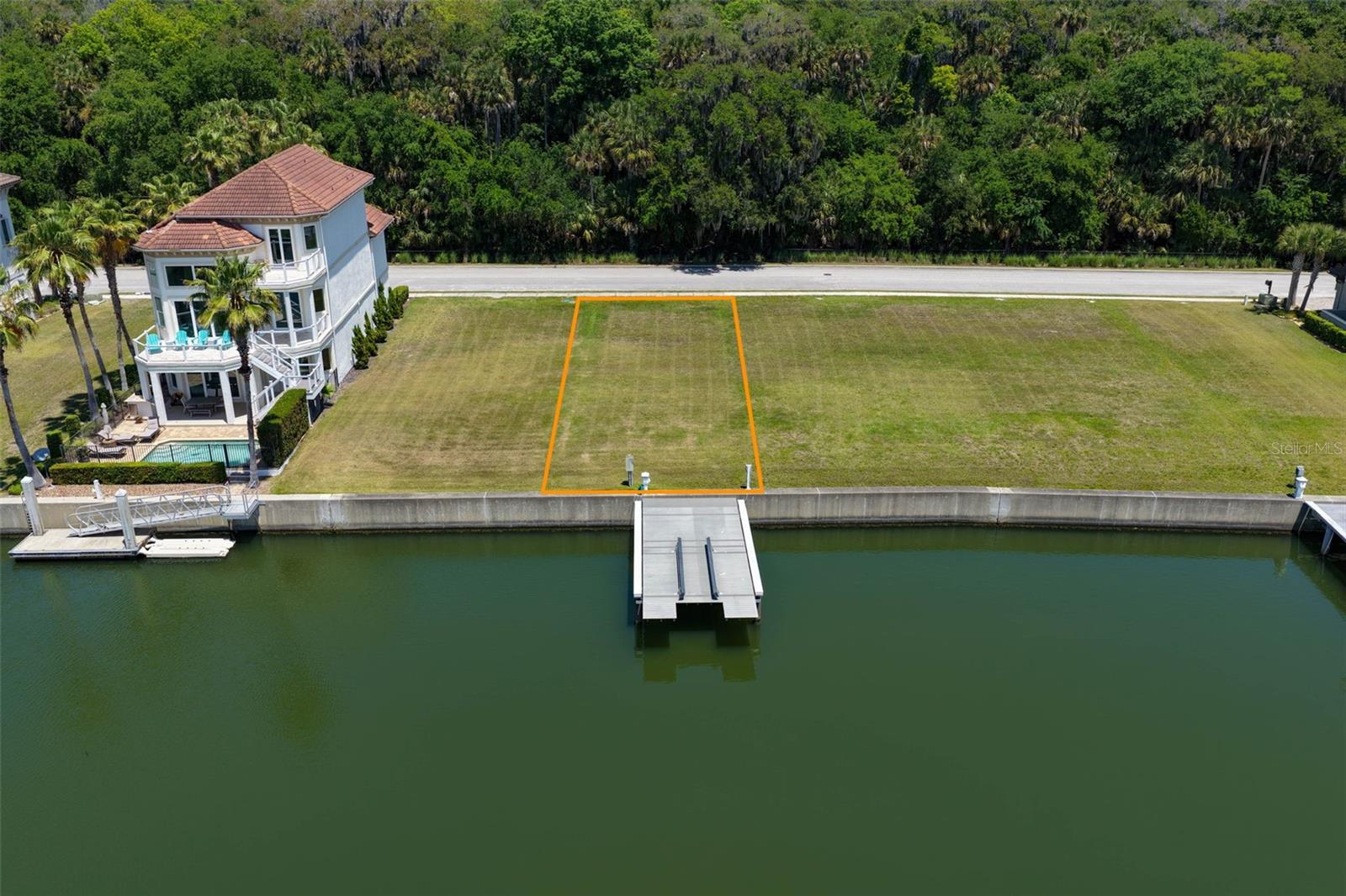 This exceptional homesite in Yacht Harbor offers the perfect setup for boating enthusiasts, complete with a private dock and high-capacity boat lift. The lift measures approximately 15’ x 36’ and features a 20,000 lb capacity, designed to accommodate a wide range of vessels with ease. The low-profile configuration allows for convenient access while maintaining a clean, unobstructed waterfront view.
The dock is fully equipped with a power pedestal providing dual 30-amp, 125-volt service—ideal for keeping your boat powered and ready to go. A dedicated freshwater connection is also in place, making washdowns and maintenance simple and convenient.
Whether you’re heading out for a day on the water or enjoying sunset views from your dock, this property offers a seamless blend of functionality and coastal lifestyle.
Located within the waterfront marina community of Yacht Harbor Village, residents enjoy convenient access to the Intracoastal Waterway and are just moments from the community marina. The property is also located near two of the area’s well-known private club communities, Hammock Beach Resort and Hammock Dunes Club, offering nearby golf, beach, and social amenities through separate memberships. This property combines waterfront living, thoughtful dock design, and a location that captures the essence of the Intracoastal lifestyle.