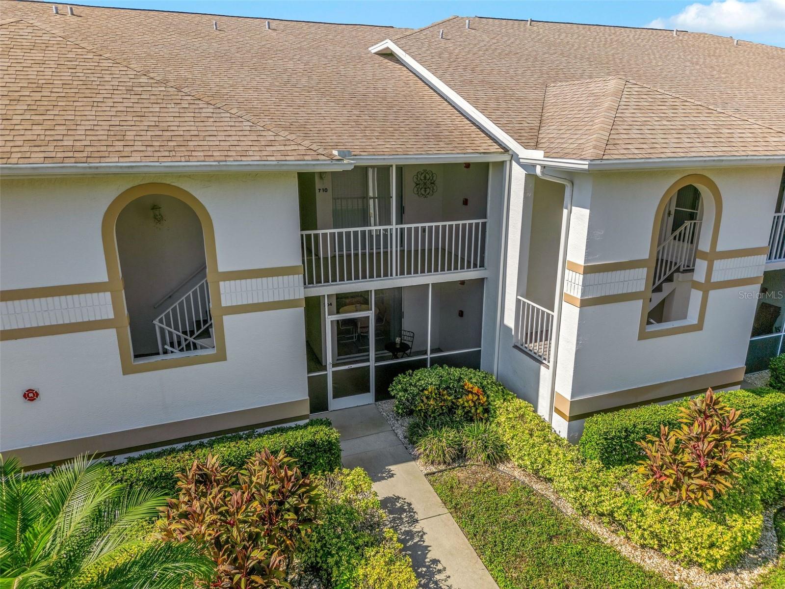 Resort-Style Living on the Golf Course Welcome home to this beautifully maintained first-floor condo with no steps to climb in the Villages at Tara, one of Bradenton’s most desirable country club communities. This 2 bedroom, 2 bath residence is designed for comfort and everyday ease. The kitchen flows naturally to a screened front porch, creating the perfect spot for morning coffee or casual dining outdoors. At the rear of the home, a sunroom with floor-to-ceiling windows overlooks the lush fairways, offering a peaceful retreat for relaxing or entertaining. Inside, you’ll enjoy an open-concept living and dining area, a split bedroom plan for privacy, an in-unit laundry, and a one-car garage for added convenience. The primary suite features generous closet space and a private bath. Ownership comes with a Class A Golf Membership, granting you full access to Tara’s championship golf course, tennis courts, fitness center, resort-style pool, clubhouse dining, and an active social calendar. Just minutes from I-75, UTC shopping, restaurants, and Gulf Coast beaches, this home combines the ease of condo living with the luxury of a country club lifestyle.