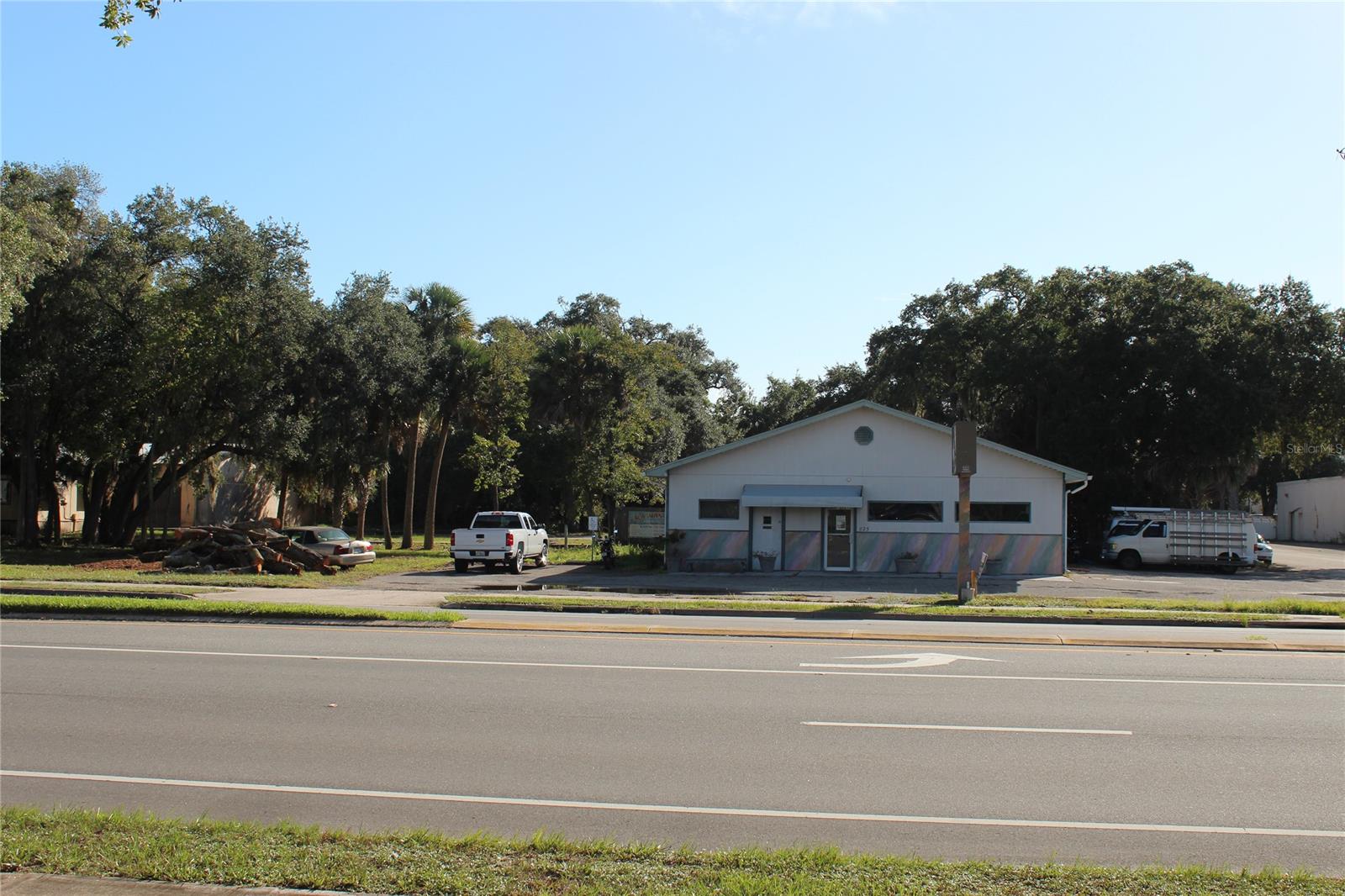 Fabulous corner lot with 300 feet of frontage on South Dixie Freeway. easy access on both S. Dixie and 1st
Street. The front building is currently leased by 1 tenant. Back building is leased as warehouse to another tenant.
Very visible from the road and both buildings have their own parking lots. The back building has a huge parking lot and a
truck well for deliveries. There is a median cut with a deceleration lane for access to the property from southbound US #1.
1st Street is a through street going to Riverside Drive. There is two address associated with this property, the second one
is 505 1st Street. There are two alternate key numbers: #3883144 & #3883152. Property is being sold as-is one price for both parcels. The front building is 40' x 60' (2,400 SF) the second address (505 1st Street) consists of a modular office (1,380 SF) and a
concrete building with 5,309 SF. total building SF 9,000+/- SF.  Legal description is lengthy, ask listing Realtor for complete legal. Surveys of both properties available. ;Water: City