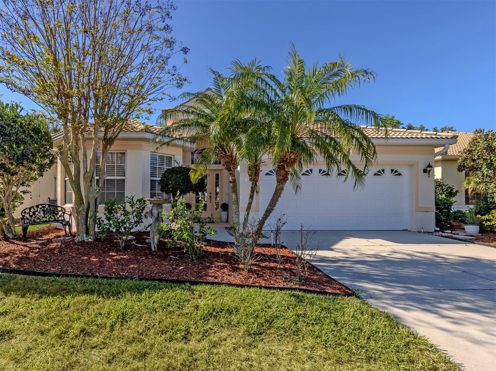 New Roof Coming Soon! Find exquisite elegance in Pelican Pointe, only minutes from historic Venice Island. Discover this meticulously updated and elegantly designed home in the exclusive gated community of Pelican Pointe, perfectly situated near charming shops, dining and beautiful beaches of Venice Island. Enter this resort style subdivision, through the iconic oak-lined drive leading to the clubhouse on the hill, offering a bar, grill and restaurant, heated pool, tennis courts, pickleball, pro shop and fitness center, all surrounded by 27 holes of golf. Although golf membership is not mandatory, the pristine golf course is both dynamic and beautiful. Enter 404 Pinewood Lake, and you’ll immediately notice the light wood-inspired flooring that flows seamlessly throughout the entire home, creating a sense of spaciousness and refined luxury. The foyer opens to the left to a comfortable guest area with a full bath, while the sun-filled den continues the warm, inviting ambiance. The great room effortlessly combines the living, dining and kitchen spaces, making it perfect for entertaining family and friends. The gourmet kitchen is the home’s centerpiece, featuring a stunning stone countertop island with sink, ample high-end cabinetry and upscale appliances, all complementing the designer aesthetic. This space is magazine-worthy, ideal for both casual gatherings and elegant dinners. The well-sized primary suite offers a serene retreat with an updated bath and a generous walk-in closet. A beautifully enclosed lanai, lined with windows overlooking the lush garden, serves as a sun-drenched room perfect for relaxation, reading or pursuing an artistic talent. Every detail of this beautiful home reflects the touch of an interior designer, creating a picture-perfect setting ready for you to enjoy. Don’t miss the opportunity to make this extraordinary home yours. Schedule your private showing today.