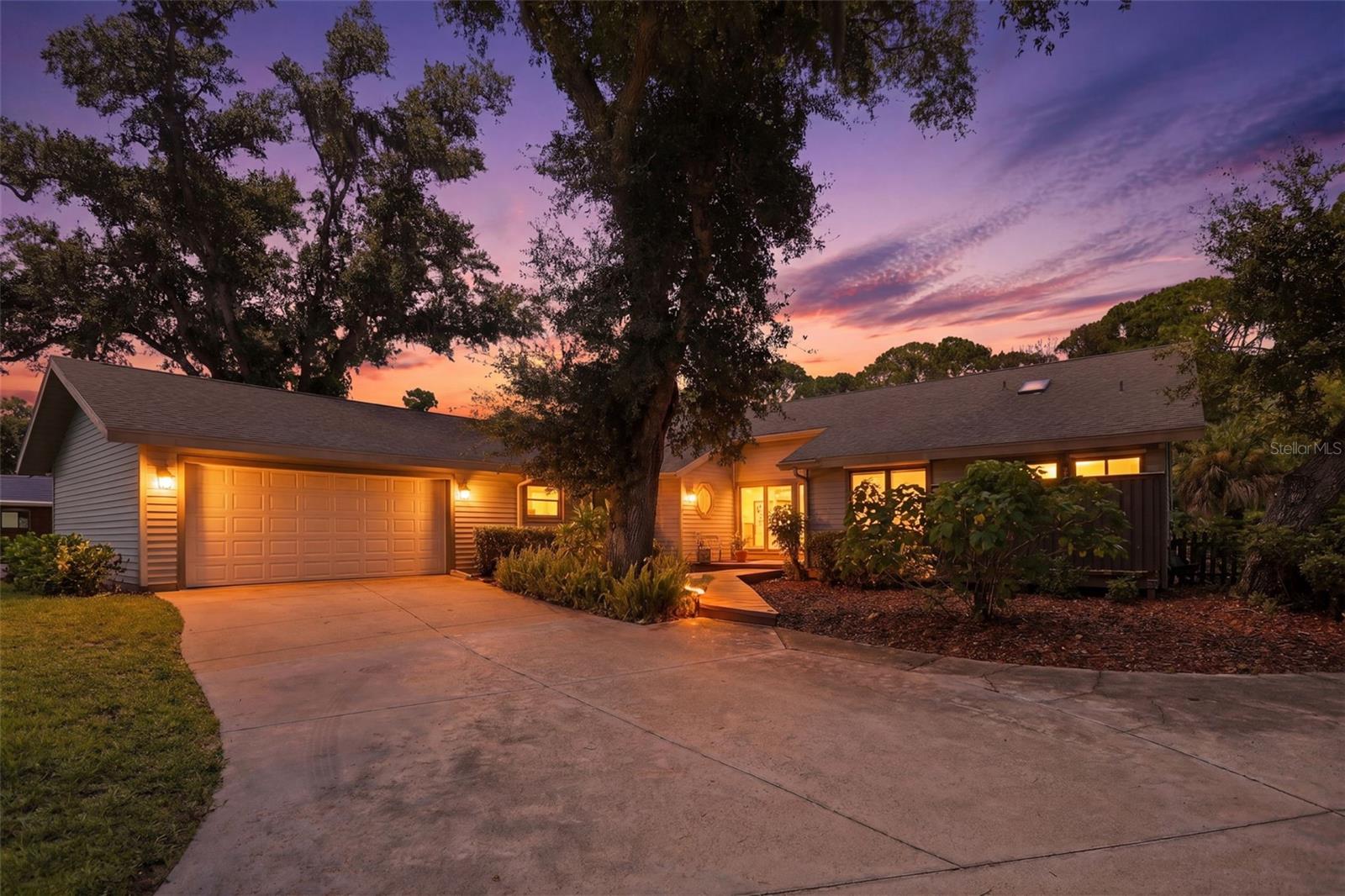 Welcome to 881 Pinto Cir., a one-of-a-kind retreat nestled on over an acre of land in highly desirable Nokomis. With no HOA, room to grow, and zoning that allows for additional structures, this exceptional property offers the perfect balance of privacy, character, and convenience.

From the moment you step inside, you'll be captivated by the home's vaulted ceilings, expansive sliding glass doors, and awning windows that flood the living spaces with natural light and create a bright, open atmosphere. Rich Saltillo tile flooring flows throughout the home, adding warmth, timeless charm, and distinctive Florida character.

Designed for both comfort and functionality, the home features an open-concept layout with spacious bedrooms, generous closet space, and custom built-ins throughout, offering style and practical storage. Gather around the cozy wood-burning fireplace on cooler evenings or simply enjoy the inviting ambiance it brings to the main living area.

Step outside to the large screened lanai, where you'll enjoy peaceful views of lush woods and natural Florida foliage. With no rear neighbors, the home backs up to a wooded area, providing exceptional privacy and a tranquil setting to relax, entertain, or enjoy your morning coffee.

The oversized two-car garage includes a built-in workbench, making it ideal for hobbies, projects, or additional storage. The property also features the convenience of city water along with a deep well dedicated to the irrigation system, helping keep the expansive grounds beautifully maintained while reducing irrigation costs.

Located just minutes from Nokomis Beach, Sarasota Memorial Hospital – Venice, shopping, dining, golf, and everyday conveniences, this home offers the best of both worlds—peaceful acreage living with easy access to everything the Gulf Coast has to offer.

Whether you're dreaming of adding a guest house, workshop, or simply enjoying the extra space and privacy, 881 Pinto Cir. presents a rare opportunity in one of Southwest Florida's most sought-after locations.

More photos coming soon. Schedule your private showing today and experience this exceptional property for yourself!