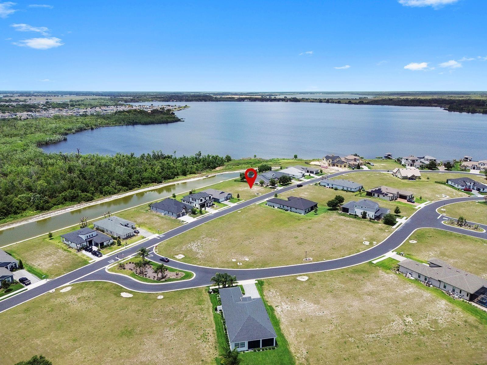 Priced to sell. Located within the exclusive gated community of Water Ridge a custom home community, this exceptional waterfront homesite offers stunning views of a freshwater canal with partial lake views of Lake Van and a protected green conservation space. The leveled lot offers maximum privacy and a peaceful natural setting. Conveniently located just 40 minutes from Walt Disney World and approximately one hour from the sandy beaches of the Gulf of Mexico, this is the perfect location to build your custom dream home. Water Ridge community offers a wide range of resort style amenities including 3 resort style community pools, a renovated fitness center, Sauna, lighted Tennis, Pickle Ball and Basketball courts, fishing piers and 2 community boat ramps. A beautiful ballroom that hosts numerous community events and social gatherings throughout the year.
