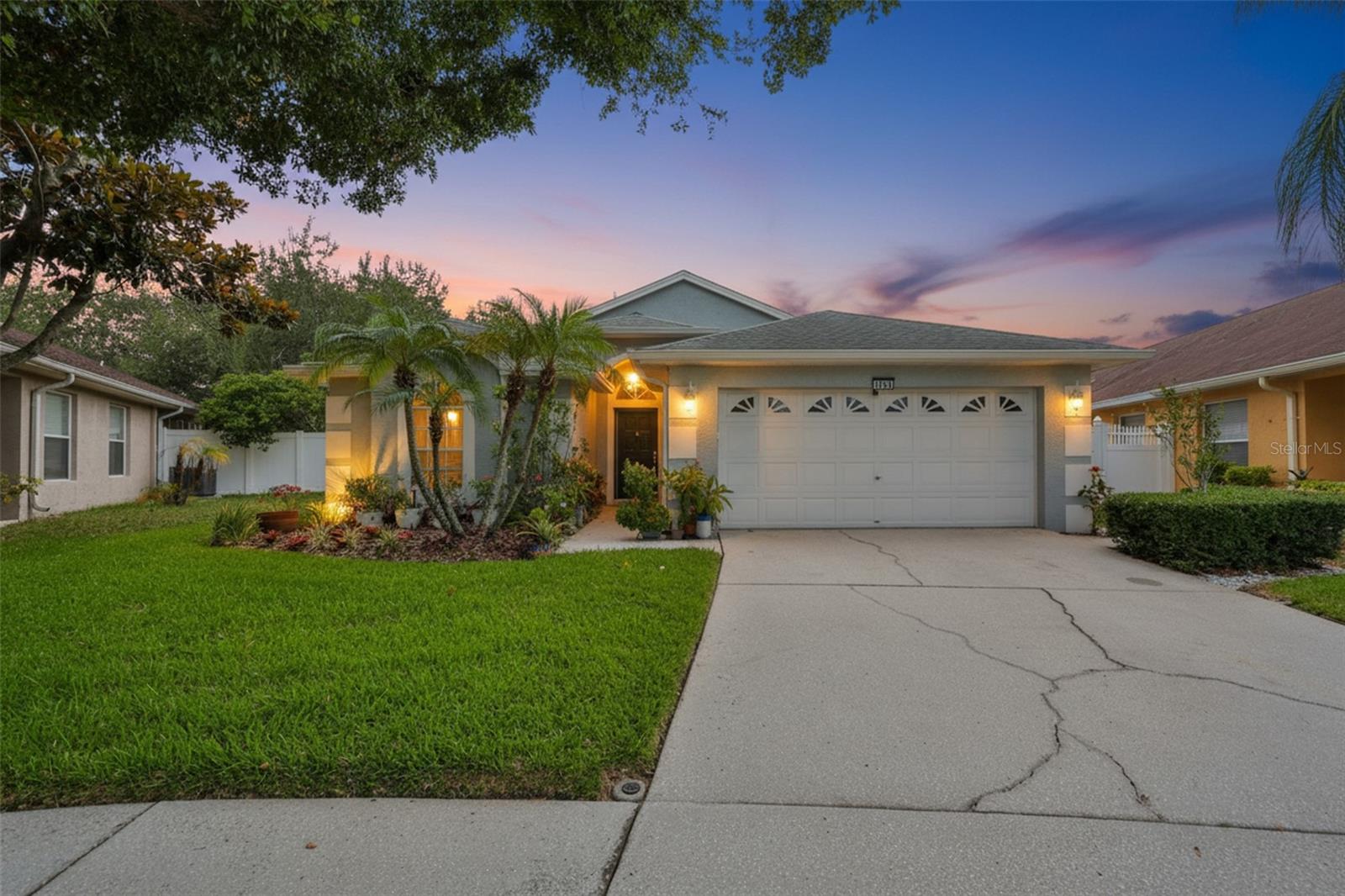 Located in the desirable Andover community in Carrollwood, this 3-bedroom, 2-bathroom home combines thoughtful updates with a functional split-bedroom floor plan and inviting living spaces designed for everyday comfort. Inside, vaulted ceilings and luxury vinyl flooring create a bright, open feel throughout the main living areas. The spacious living room flows seamlessly into the dining area and updated kitchen, where quartz countertops, a large center island, and ample workspace make it easy to cook, gather, and entertain. A custom built-in bar adds character and serves as a natural gathering spot when hosting family and friends. The oversized primary suite offers a walk-in closet and private bath, creating a comfortable retreat at the end of the day. Two secondary bedrooms are positioned on the opposite side of the home, providing flexibility for family, guests, or a home office. Step outside to the screened lanai and enjoy a fully fenced backyard filled with mature landscaping and flowering plants that attract hummingbirds and butterflies. Whether enjoying your morning coffee or unwinding in the evening, the outdoor space offers a peaceful extension of the home. Additional features include a 2022 HVAC system, indoor laundry room, two-car garage, low HOA fees, and Flood Zone X designation. Conveniently located near the Veterans Expressway, Tampa International Airport, shopping, dining, parks, and everyday conveniences, this home offers the perfect balance of neighborhood charm and accessibility.