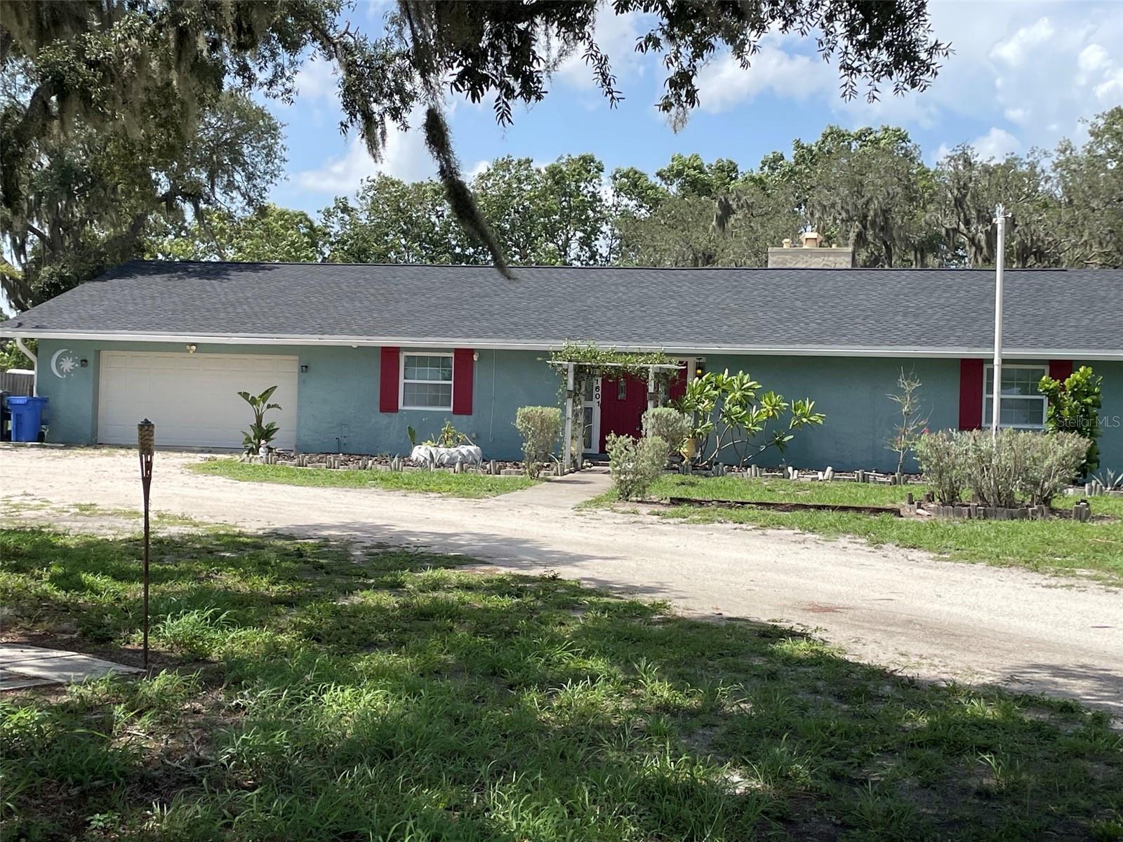 Welcome to this beautiful country-style home situated on 1 acre of land, offering privacy, space, NO HOA, NO CDD's and endless possibilities. This updated 3-bedroom, 2-bath property features a new roof, new well, new flooring, updated bathroom appliances, and fresh interior paint. The outdoors 1 acre of land is ideal for animals, gardening, outdoor fundays, grilling, parties, camping, playground with a touch of some newly planted fruit trees already in place. Home includes handicap-accessible bathrooms and a spacious 2-car garage. Plenty of space along the fireplace on cold nights, well entertaining family and friends in the country living.  Beaches within mins from home along with, Boat Ramps, and Parks and Community Golfing. Home is Move-in ready and perfect for buyers seeking land, comfort, and modern updates.