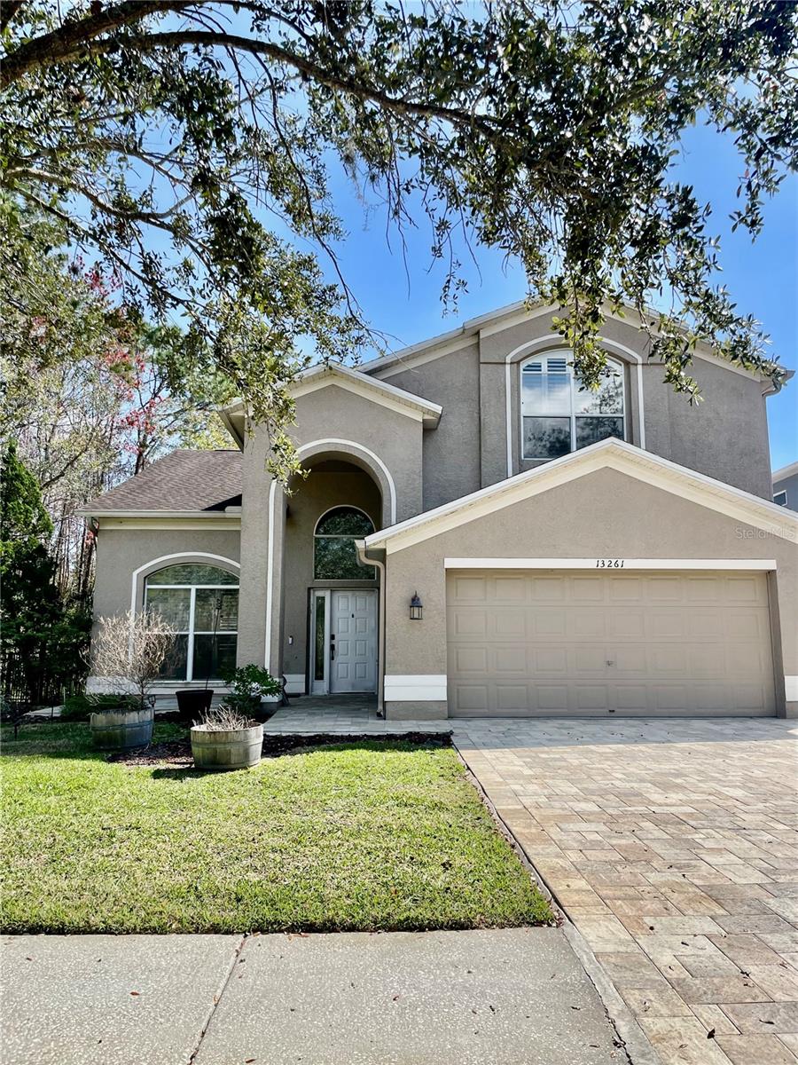 Discover the perfect blend of comfort, privacy, and Florida lifestyle in this beautifully maintained home located in the sought-after gated community of The Eagles Golf Club.
Set on a peaceful lot with scenic views and a tranquil backdrop, this RECENTLY REMODELED spacious two-story residence offers an inviting layout designed for both everyday living and entertaining. Step inside to soaring ceilings, abundant natural light, and a welcoming great room featuring a cozy fireplace and views of the surrounding greenery.
The heart of the home is the thoughtfully updated kitchen, featuring modern cabinetry, quartz countertops, stainless steel appliances, and a generous breakfast area—creating the perfect space for morning coffee, family meals, or gathering with friends.
Upstairs, the flexible floor plan offers four bedrooms, providing plenty of space for family and guests. The primary suite offers a relaxing retreat with plenty of natural light and a large custom walk-in closet designed by California closets.  Other recent upgrades include Kohler bath fixtures, a large soaking tub, a Toto washlet system, and custom California closet systems throughout the home.
Enjoy the outdoors from the screened lanai overlooking the private conservation setting—a peaceful place to unwind, entertain, or simply enjoy Florida’s natural beauty. The spacious fenced in yard offers room to create your own outdoor oasis.
Additional highlights include new sod with reclaimed water irrigation system, tankless water heater, upgraded finishes, custom storage solutions, and a two-car garage.
Located within The Eagles Golf Club, residents enjoy a gated community lifestyle with championship golf, clubhouse amenities, recreation areas, and convenient access to top-rated schools, shopping, dining, and major roadways.
A rare opportunity to own a move-in ready home in one of Odessa’s most desirable communities—schedule your private showing today!