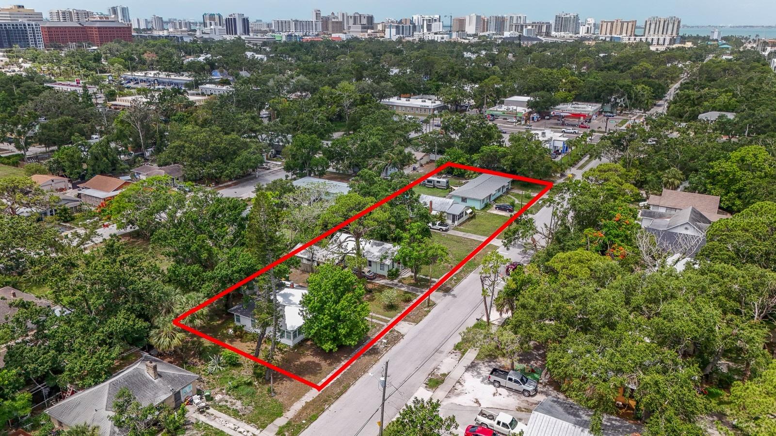 This centrally located, five-parcel assemblage in Sarasota’s Park East neighborhood offers  a rare redevelopment opportunity in an area experiencing ongoing growth. Totaling approximately 35,000 square feet (350 road frontage x 100) deep or (0.80 acres), the site currently includes five income-producing rental units bringing in a total of $8,250 per month. The property is also situated within an Opportunity Zone.  Zoning allows for mixed-use development with ground-floor commercial and multifamily  residential uses as well as hotel developments with ground-floor commercial. The  property supports a base density of 25 units per acre, with the potential to achieve up to  100 units per acre through participation in the City of Sarasota’s Attainable Housing  Density Bonus Program. Building heights of up to four stories are permitted under  current zoning.  The property is strategically located near downtown Sarasota, US-301, Fruitville Road, and  I-75, offering convenient access to local employers, retail corridors, and regional  transportation. Nearby recreational and cultural amenities include Bayfront Park, Payne  Park, Gillespie Park, and the Rosemary District.  Rental income provides holding revenue while entitlements and development planning  are pursued. Buyer is responsible for  verifying all zoning regulations, density bonuses, and development entitlements with the  City of Sarasota.