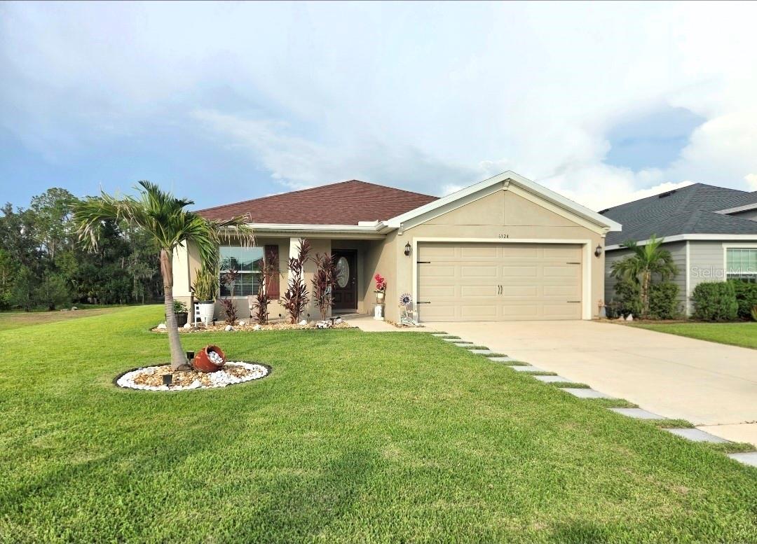 Welcome home! Whether you're enjoying your morning coffee on the lanai or hosting a sunset dinner, this home is designed for the Florida lifestyle.  Featuring a thoughtfully designed 4-bedroom split floor plan with builder premium upgrades, this home offers flexibility for a growing family, a dedicated home office, or comfortable guest accommodations. Custom upgraded lighting throughout creates a bright , inviting atmosphere both day and night.  One of the home's standout features is its fully paid solar panel system, delivering exceptional energy savings with an average monthly electric bill of just $32.  Step outside to your semi-private backyard, where there are no rear or left-side neighbors, providing a rare sense of privacy. The home backs to protected conservation land and scenic nature trails, creating a peaceful setting surrounded by Florida's natural beauty.  Beyond your backyard, residents of The Aviary at Rutland Ranch enjoy an exceptional resort-style lifestyle with exclusive community amenities, including: Heated resort-style swimming pool with cabana, Pickleball and half basketball courts, Family-friendly playground, Scenic walking and hiking trails throughout beautifully landscaped conservation areas.  Perfectly located in Parrish, Florida this home offers convenient access to Bradenton, Sarasota, and St. Petersburg, while being just a short drive from the world-renowned white sandy beaches of Florida's Gulf Coast.  Homes offering this combination of privacy, conservation views, luxury amenities, and remarkable energy efficiency rarely become available. If you're looking for a home that blends modern comfort, natural surroundings, and significant long-term savings, this is an opportunity you won't want to miss.