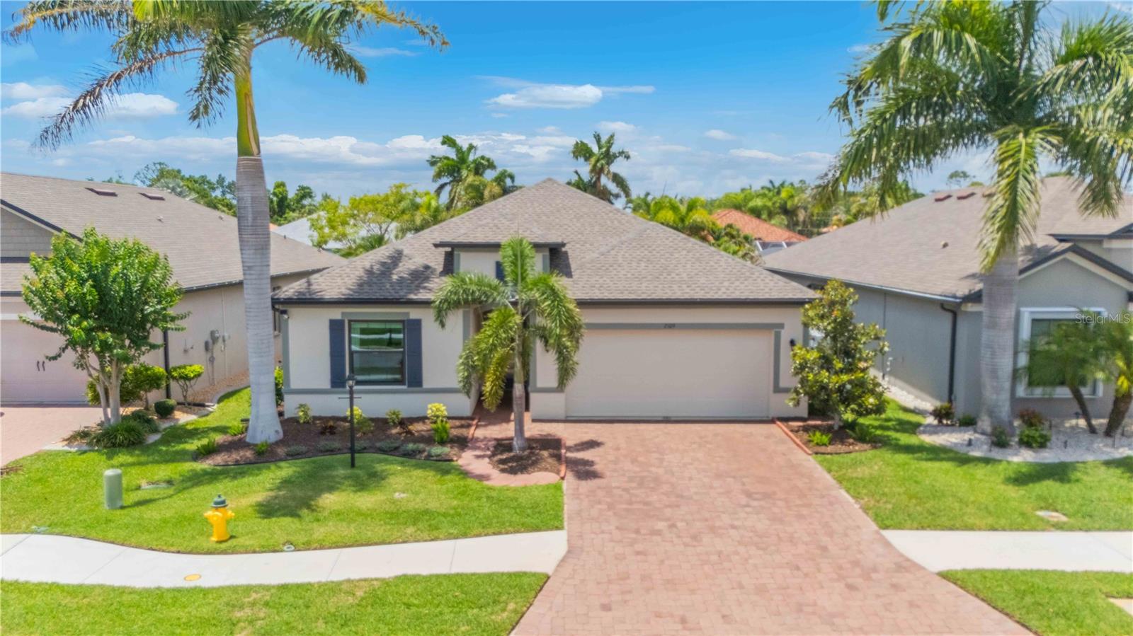 Under contract-accepting backup offers. Welcome to your piece of paradise in the highly sought-after gated community of Villa Milano! This better than new home features upgrades not found in most others, including IMPACT WINDOWS AND SLIDERS  added in 2024 while still having metal hurricane shutters giving you an optional second layer of protection if desired. Upon arriving to the home you will notice stunning curb appeal with a pavered driveway, 2025 BRAND NEW ROOF, some of the most impressive palm trees and landscaping in the community and once inside you will continue to be impressed. No carpet anywhere! Modern tile has been added throughout the home including in the screened in lanai. The kitchen also features upgrades rarely in this price point including a built-in double wall oven, cooktop, tile backsplash and more! The master suite is well oversized and has plenty of closet storage along with his & her sinks, a walk in shower, and garden tub. The 3 guest bedrooms are on the opposite side of the home giving you plenty of privacy from others. The guest bathroom matches the rest of the home, and the interior laundry room has built in storage. The backyard is just as impressive as the rest of the home, with stunning landscaping and a privacy fence allowing you to truly enjoy your yard. This community is a hidden gem, offering luxury living in a quiet neighborhood at a very affordable price, with low HOA dues, no CDD, privacy gate, and a heated community pool overlooking a beautiful pond. Only a few minutes to Charlotte Sports Park, Tampa Bay Rays Stadium, Charlotte County Fairgrounds, and more. Plus a 15-mile drive will have you enjoying the various Englewood beaches! Ask your agent for a copy of the fully interactive 3D tour and prepare to fall in love!