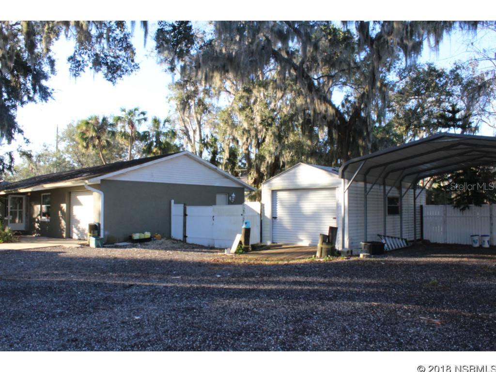 Beautiful Florida Shores home North of 442/Indian River. This home is on a Large TRIPPLE lot property with a detached garage and overhang. It also has a very large above ground pool in the back yard. There are 3 bed rooms. ;Water: City