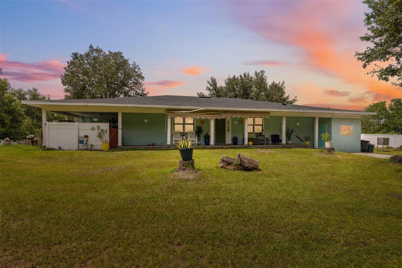 Stunning Custom Home on 1.63 Acres in Wesley Chapel. Discover this beautifully renovated, one-of-a-kind home featuring: 4-Bedrooms, 2-Bathrooms, and a versatile bonus room. Nestled on a serene 1.6 acre lot- free from HOA or CDD fees! This exceptional property offers unmatched privacy, abundant charm, and ample indoor and outdoor space. Recent upgrades include: Roof (2025) - Air Conditioning System (2022) - Water Heater (2024). Relax and entertain in style with multiple outdoor seating areas designed for tranquility and enjoyment! The bonus room provides the perfect space for a home office, while the enclosed and air-conditioned garage conversion offers flexibility to make use as an additional storage, entertainment/gameroom, or even a home fitness area. Whether you're seeking a peaceful retreat or room to expand, this unique property presents endless possibilities. Don't miss your chance to own this rare piece of property located in the heart of Welsey Chapel, contact for more information and to schedule a private showing.