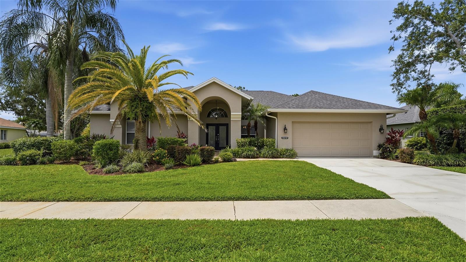 RARE FIND in the much sought after community of River Club just minutes away from Lakewood Ranch Main Street! This TURNKEY OPTIONAL amazing Arthur Rutenberg custom built home features 2551 square feet of well planned space, with a spacious split floor plan, high ceilings, extended lanai and oversized pool to name a few. Classic 23 inch ceramic tile, on the diagonal throughout, neutral paints, open floorpan and extras like tiled fireplace and oversized sliders give a welcoming feel. Four bedroom and three baths offer ample space and privacy. Relax in your oversized outdoor covered space, view nature on the pond and just outside of your lanai. Truly a spectacular home, in the community of River Club with NO CDD, and LOW HOAs, conveniently located in close proximity to multiple entertainment districts including Lakewood Ranch Main Street, Waterside,  and UTC Mall and on a large lot with mature landscaping. Home had a NEW ROOF installed in 2025 as well. Book your appointment today!
