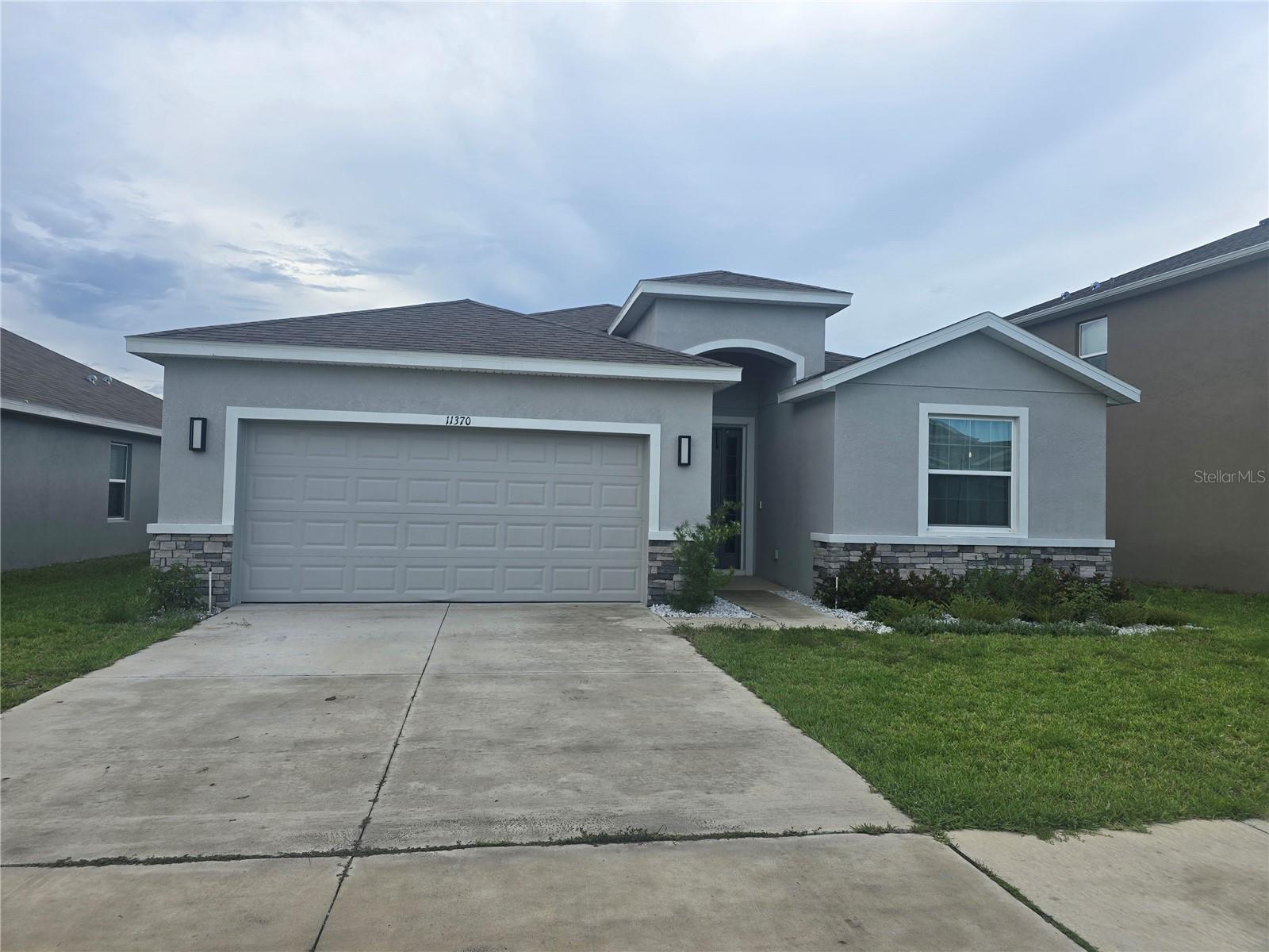 Located in the beautiful Waterford community, this nearly new 4-bedroom, 2.5 bath home built by D.R. Horton offer 2,057 square feet of modern living space and was completed in 2023. Lightly lived in and exceptionally maintained, this smart home features quartz countertops,stainless steel appliances, an open-concept layout, and stylish finishes throughout.

This spacious kitchen includes a large center island with seating and flows seamlessly into the dining and living areas, creating an ideal space for entertaining and everyday living. The private primary suite features an ensuite bath with dual vanities, garden tub, walk-in shower, private water closet, and oversized walk-in closet. Built with block construction and stucco exterior, the home also includes in wall pest control protections for added convenience.
Step outside to the covered rear patio, perfect for morning coffee or relaxing evenings and there are no backyard neighbors. For additional privacy fences are allowed. A  2-car garage  provides ample parking and storage space. With limited 4 bedroom homes available in the community, this property stands out as an exceptional opportunity in the Waterford's original phase.
Leasing is permitted, making this property attractive for both homeowners and investors  alike. Schedule your showing today and experience the lifestyle Waterford has to offer.