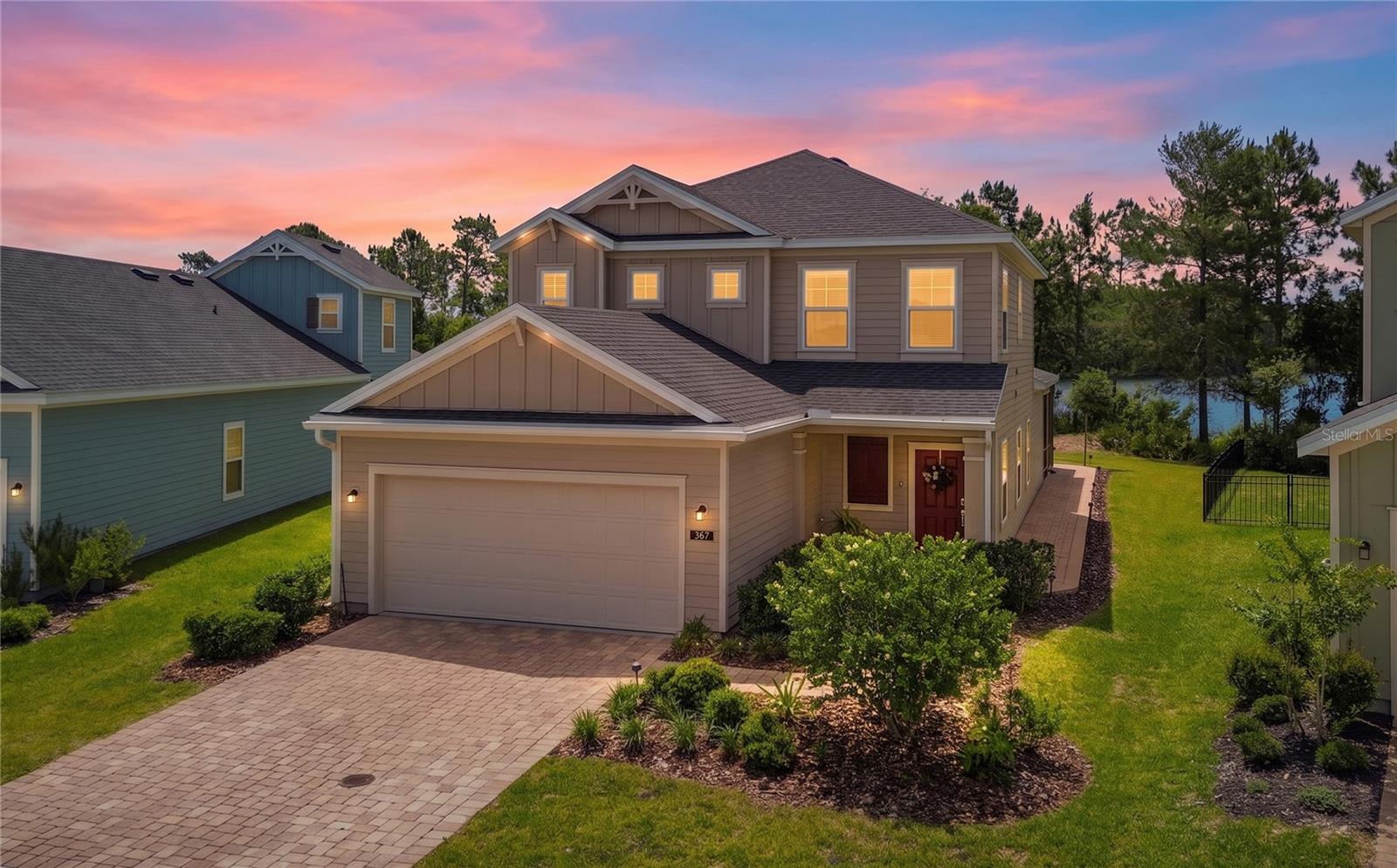 Welcome to 367 Lake Sinclair Street, situated on arguably the best lot in all of St. Augustine Lakes. Perfectly positioned on an oversized lakefront homesite, this home offers peaceful sunrise views over the water, extra outdoor space, room for a future pool, and a level of privacy that is hard to find in a newer community.

Built in 2023, the home was thoughtfully designed with high-end finishes throughout and has been meticulously cared for by the seller since day one. Inside, you’ll find a bright, modern layout with quality selections, clean finishes, and a true move-in-ready feel.

The standout feature is the upgraded outdoor living space, thoughtfully designed to showcase the gorgeous lake view. The seller added a beautiful pavered patio, including a screened-in portion for relaxing comfortably year-round, plus an open-air extension that stretches toward the lake—perfect for grilling, entertaining, or enjoying quiet mornings with a view. The backyard also offers plenty of space to add a pool while still preserving the beautiful lakefront setting.

St. Augustine Lakes is one of the area’s hidden gems: a peaceful, quiet neighborhood tucked away from the busier parts of town, yet still within easy reach of historic downtown St. Augustine, shopping, dining, and the beaches.

If you’ve been looking for a newer home with premium finishes, an exceptional lot, and a serene lakefront setting, this is the one!
