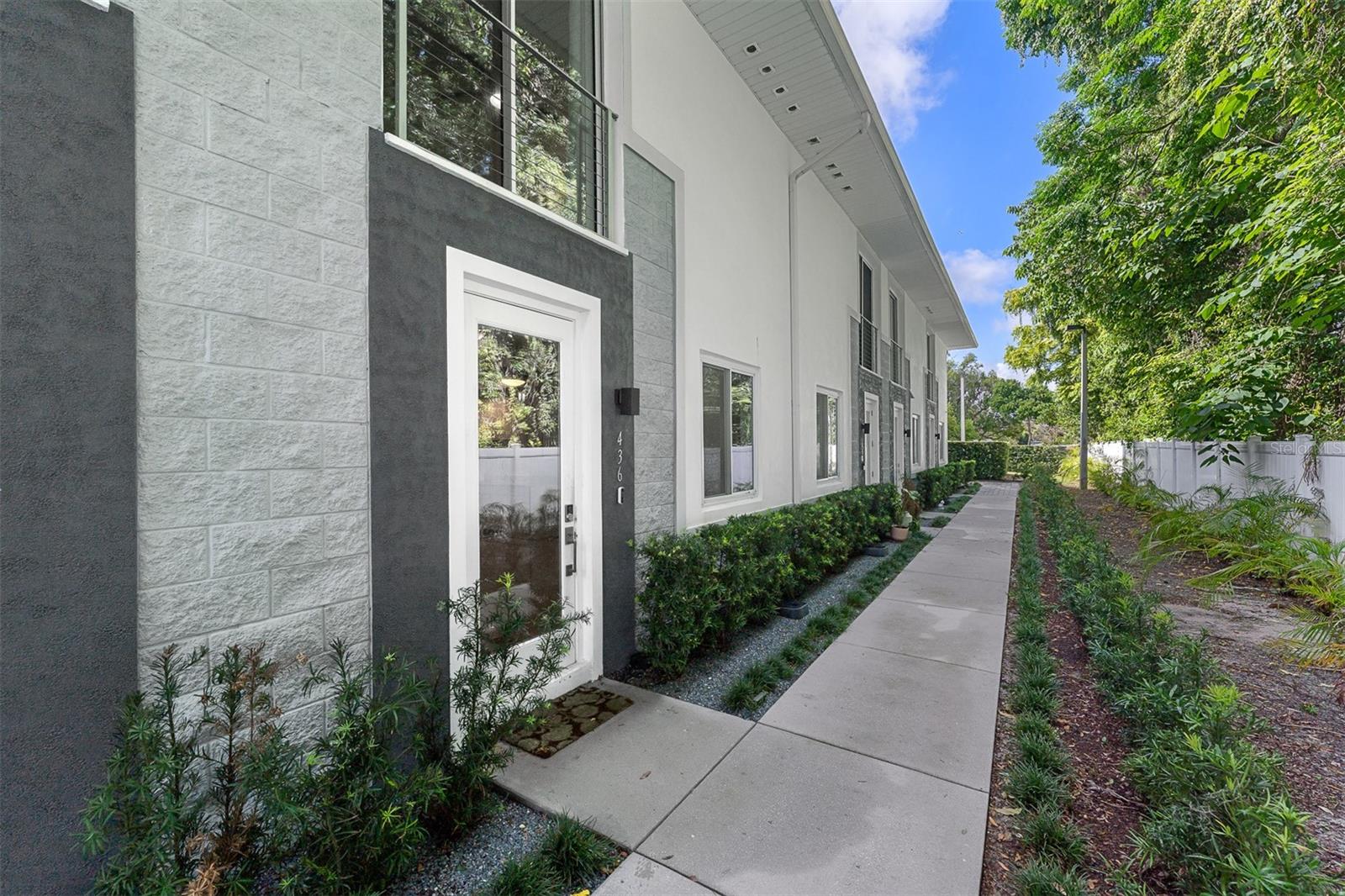 Virtually Staged. Welcome to this virtually staged contemporary townhome in the desirable 400 West community, home to just nine residences and steps away from lively Park Avenue. Enter through the private garage or the charming front path, and you'll find a bright and open main floor that perfectly balances comfort and modern style. 

The main floor features a stylish mix of finishes, including large-format porcelain tiles, level 4 drywall, tall baseboards, and designer lighting. The centerpiece is a sleek kitchen equipped with glossy white cabinetry, chic chrome pulls, quartz countertops, and top-quality stainless-steel appliances. The garage, with alley access, includes a storage closet and built-in shelving for added convenience.

On the second level, discover two spacious primary suites with modern LVP flooring and large windows that let in plenty of natural light. The en-suite bathrooms are designed with porcelain tiles, frameless glass showers, wall-to-wall mirrors, and matte white vanities. The primary bath offers a double-sink vanity, a private water closet, and a spacious walk-in closet. A conveniently situated laundry room features a Samsung washer and dryer with overhead storage.

The third level has two more bedrooms, each with walk-in closets, connected by a shared Jack-and-Jill bath, making it ideal for guests, a home office, or a workout space. Don’t miss the chance to check out this fantastic home in a prime location where luxury meets practicality!