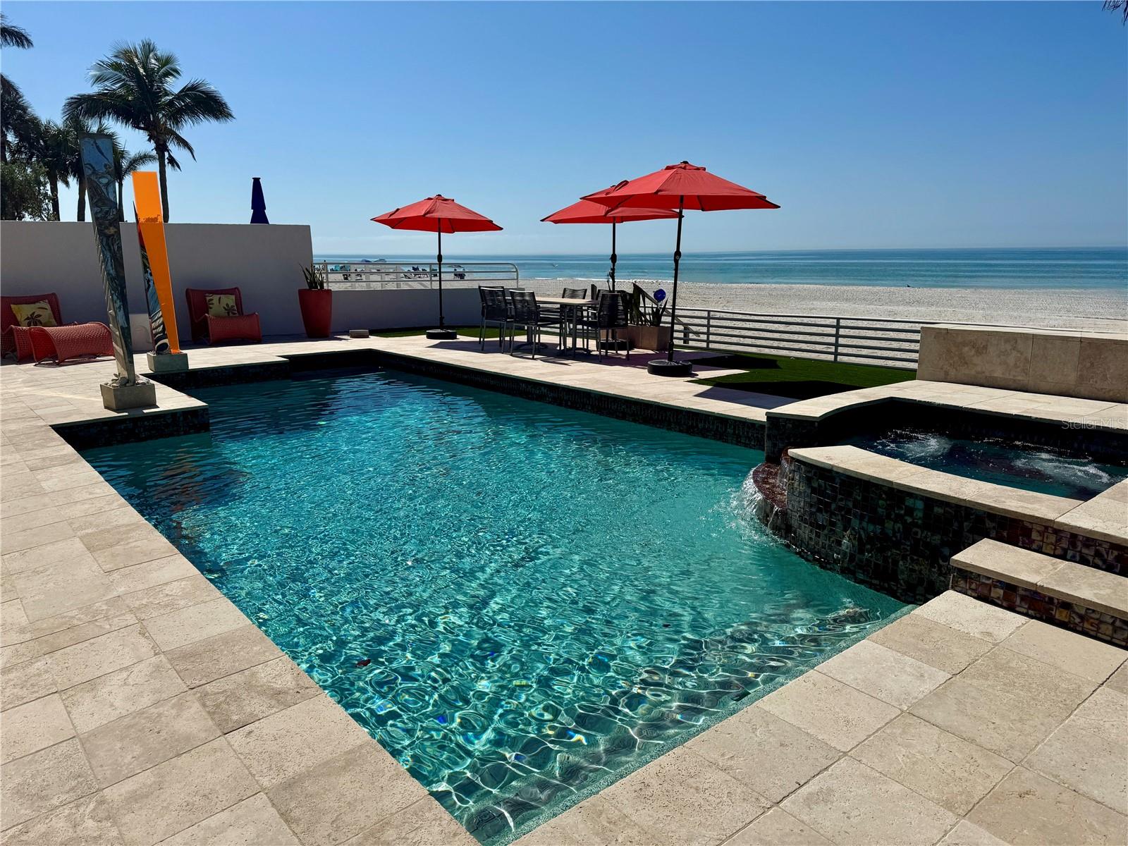 Under contract-accepting backup offers. This stunning contemporary beach home is one of a kind head turner with the beach for a back yard! It is one of four unique homes located on the only private driveway in Indian Rocks Beach. The Family, Dining, Kitchen, Master Bedroom and Master Bath all have stunning full beach views. The first floor entrance welcomes you with hand created stained glass double front doors that open to the winding metal and wood floating spiral staircase. The staircases is accented with a curved glass block wall. The sunken Grand Formal Living Area has floor to ceiling glass windows and vaulted ceiling. The 4th bedroom on the lower level has been transformed into a dual office with desks, built-shelving and a walk-in closet. Off of the 4th bedroom is a half bath with a 42 in cabinet, granite top, and stone vessel sink. Formal dining room features a three tiered ceiling with tri-colored neon lighting and the L-shaped serving credenza provides ample storage and serving areas. Moving into the kitchen you will find matching Miele stainless built in convection oven, microwave, warming drawer and cappuccino/coffee system machine. The 5 burner glass top induction stove sits atop granite countertops. Sub Zero side by side refrigerator and Fisher & Paykel dish washing drawers. The seamless stainless steel sink and countertop was fabricated by hand into a single piece of metal. Italian custom made Lube cabinets have under cabinet lighting, hinged glass doors pull-up doors and mini-pulldown garage-door. There is a 3 stool kitchen bar and larger breakfast nook. The wet bar in the breakfast nook has matching granite top above the Scottsman stainless wine refrigerator, mini-fridge and Sub Zero ice maker. The full bathroom off the breakfast nook has glass vessel sink, shower and door that leaves to the beach. The Family room/Media area includes a remote fireplace. It connects to a sunken Family Room with oversized glass sliding door creating the best spot for a awesome sunset viewing nightly. This room also has raised backlit ceiling. The second floor Master Suite has same sliding door leading to breathtaking views from the balcony. The oversized Master includes dual sided fireplace and wrap around built in closets/shelves. Double doors lead into the Master bath that includes split sinks with granite tops, Jet tub below a chandelier and separate shower. (and yes more beach views) A pocket door opens to reveal the Master walk-in closet room. Laundry room has tile floor, cabinets and washer/dryer. 2nd bedroom has attached bath. Granite top sink Bath/shower. There is a long hallway with views of the Grand Formal Living room that will take you to the 4th Bedroom located above the garage. Step down in to the guest room that has walk-in closet and attached bathroom. The newly remolded bath has granite counters and a glass encased shower with custom tile work and river rock flooring. The beautiful pool area has a heated Beadcrete glass beaded pool and spa along with turf for low maintenance. There are stairs that lead from the pool area into the white sands of the beach. Vacation home or full time living, the choice is yours.