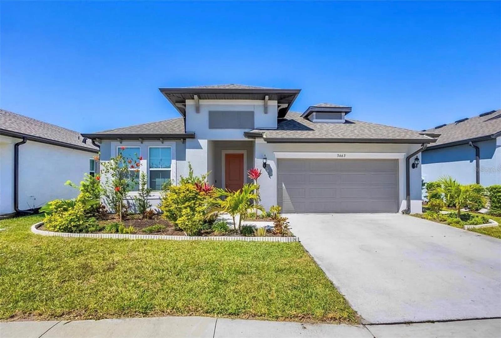 Welcome to this exceptional **2022 M/I Homes Calusa model**, where modern design, quality craftsmanship, and an unbeatable Sarasota location come together to create the perfect place to call home. Meticulously maintained and move-in ready, this beautiful residence offers approximately **2,197 square feet** of thoughtfully designed living space with **4 bedrooms, 3 full bathrooms**, and an inviting open-concept floor plan ideal for today's lifestyle.

Step inside and you'll immediately appreciate the bright, airy atmosphere created by abundant natural light and spacious living and dining areas that flow seamlessly together—perfect for entertaining family and friends or enjoying everyday living. The desirable **split-bedroom layout** provides added privacy, with the spacious primary suite tucked away from the secondary bedrooms. The owner's retreat features a generous walk-in closet and a beautifully appointed ensuite bathroom designed for comfort and relaxation.

At the heart of the home is the stylish modern kitchen, complete with a large center island, abundant cabinetry, generous counter space, and an open design that overlooks the main living areas, making it ideal for both casual meals and entertaining guests.

Step outside to the **screened, covered lanai**, where you can unwind while enjoying peaceful **pond views** and Florida's beautiful weather year-round. Whether you're sipping your morning coffee or hosting an evening gathering, this tranquil outdoor space is the perfect extension of the home.

Additional features include a **two-car attached garage**, contemporary finishes throughout, and the peace of mind that comes with owning a nearly new home built by the highly respected **M/I Homes**.

Ideally located with **easy access to I-75**, this home places you just minutes from the vibrant community of Lakewood Ranch and approximately **20 minutes from downtown** Sarasota. Enjoy world-renowned Gulf Coast beaches including Siesta Key Beach and Lido Key Beach, along with exceptional shopping and dining at University Town Center (UTC). Outdoor enthusiasts will love exploring nearby parks, nature preserves, golf courses, walking and biking trails, while arts and culture lovers can visit the The John and Mable Ringling Museum of Art, theaters, galleries, and the bustling downtown waterfront. Medical facilities, top-rated schools, and everyday conveniences are all just minutes away.

Whether you're searching for a full-time residence or a seasonal retreat, this beautifully designed home offers the perfect combination of modern comfort, scenic surroundings, and an outstanding Sarasota location. Don't miss the opportunity to make this exceptional property your own!