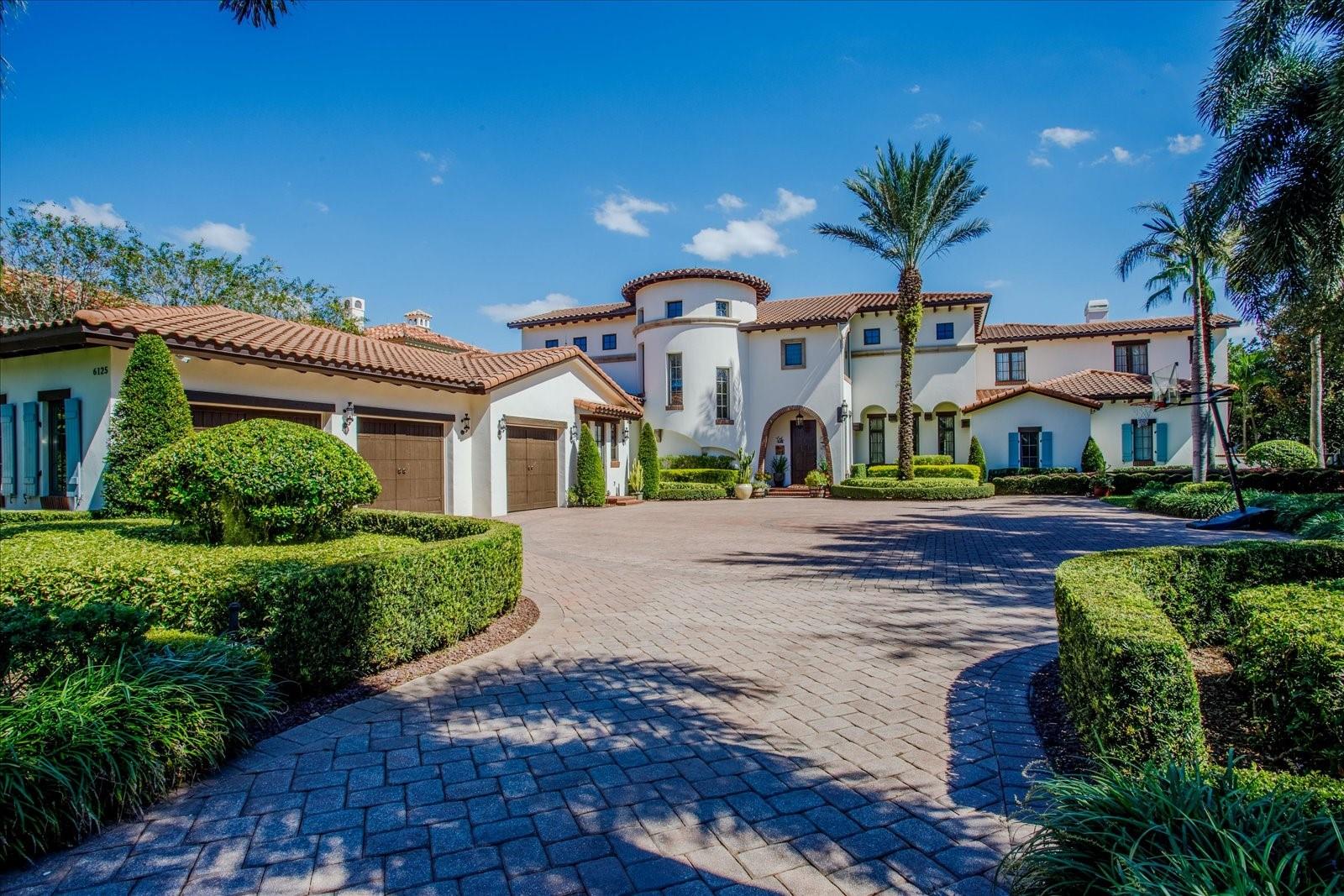 Stunning lakefront home in the highly desired, gated/24 hour guarded community of Keene’s Pointe.  This home was thoughtfully built by highly regarded custom home builder Goehring & Morgan. No detail was spared on this private 4-acre estate home located on Lake Tibet Butler of the famed Butler Chain of Lakes.  From the moment you enter you are surrounded by elegant finishes, beautifully detailed ceilings and floors and luxurious decor. The functional floor plan offers 6 en-suite bedrooms - two on the first floor and three on the second floor and the first floor primary suite with spacious bath, walk-in closet and its own spiral staircase leading to the upstairs master retreat - currently used as a second closet, it can also be converted back to a library/office/den. Also on the first floor, you will find the formal living/dining room, a kitchen/family room combo, butler's pantry, one of two laundry rooms, a wine cellar and gym.  The gym is located off the primary suite corridor and can also be converted to a 4th garage pleasing the car enthusiasts. Both the living and family rooms open up to the stunning covered lanai with fireplace and summer kitchen that leads to the stunning pool area with a beautiful view, gazebo, fire pit, sports court, and your own private dock that gives you access to the lake. The second floor also features a media/game room and spacious balcony, one of the many perfect places to relax and enjoy the lake view. Keene’s Pointe is also home to The Golden Bear Club a membership-only club featuring golf, tennis, fitness, dining and swimming. Among Windermere's best private and public schools and just minutes to shopping, restaurants, and world-famous theme parks!