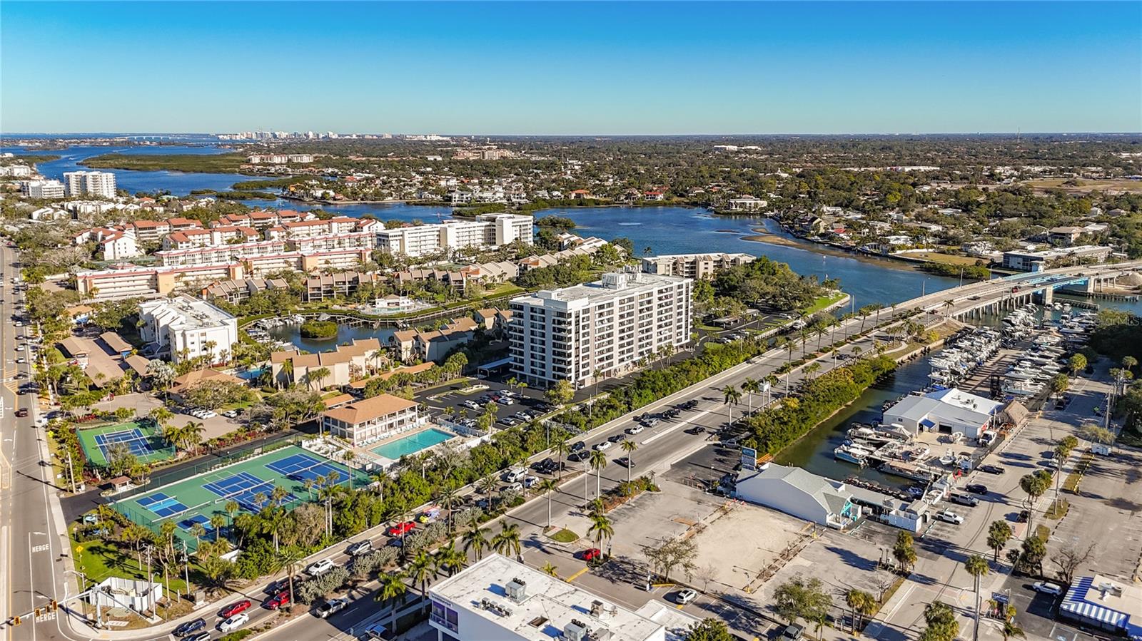Welcome to the best location on Siesta Key. The Anchorage is located on the corner of Stickney Point and Midnight Pass. It’s all about convenience and living the good life. Walk to bars, restaurants, the beach. You can walk across the street and rent a boat. Speaking of boats you can dock your boat on our giant seawall for $10.00... yes...ten dollars a month. Your new condominium is an open floor plan with living room/dining room combo. All three rooms have hurricane sliding doors. The main bedroom is very large and the master bath has a walk-in shower. The guest bedroom has 2 double beds with a tub/shower! You also have one covered parking space underneath the main building valued at $25,000.00. We have a beach easement to Siesta Key beach! Our Seawall was replaced in 2019. The building and grounds are in wonderful shape! The Anchorage has so many amenities to offer owners and renters, including an Olympic-size heated swimming pool, Fitness Center, Lighted Pickleball & Tennis Courts, Clubhouse, BBQ & Picnic Areas and Kayak Storage! There is a trolly that you could take to Siesta Key Village to enjoy more shopping, entertainment and dining options. The Anchorage is very conveniently located near Stickney Point Bridge to give you easy access to the mainland, including downtown Sarasota!