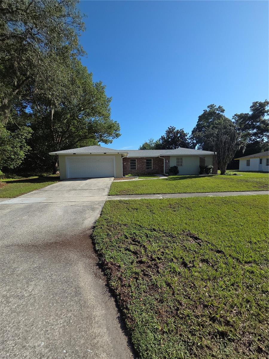Welcome home to this move-in-ready 3-bedroom, 2-bathroom concrete block home, designed for comfort and easy living. Split floor plan ensures maximum privacy. Master suite features a private bath. Vinyl flooring flows seamlessly throughout the entire home. Storage space is abundant with closets everywhere. Florida room provides perfect year-round bonus living space. Two-car attached garage offers secure parking and extra shelving. Fenced backyard delivers a private oasis for pets and play. Storage shed stays with the property for tools and toys. Block construction provides excellent durability and energy efficiency. This home perfectly blends functional indoor storage with highly desired outdoor features. New AC, New Water Heater Roof 2023.