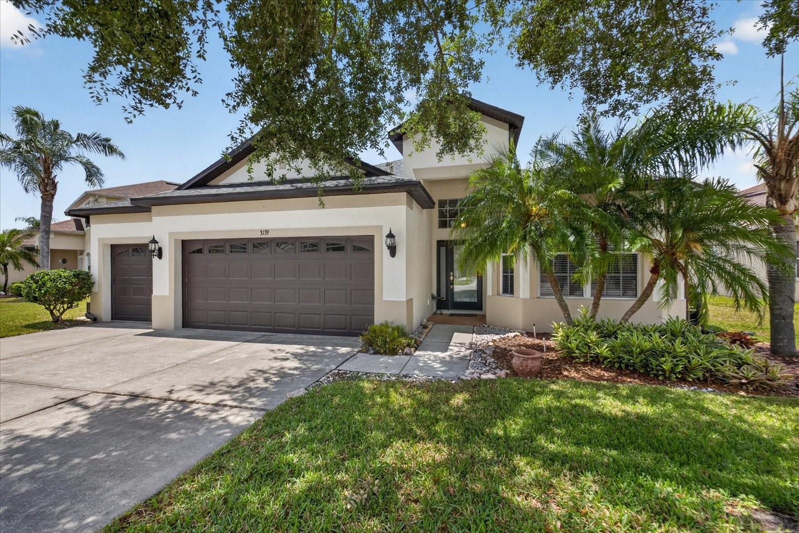 Meticulously maintained 4-bedroom, 3-bath, 3-car garage home featuring a brand-new 2024 roof, 2020 A/C, and a new 50-gallon water heater, offering major peace of mind for Florida buyers. A whole-house water softener paired with a kitchen reverse osmosis dispenser provides clean, filtered water throughout, a true Florida luxury. The thoughtful 3-way split floor plan offers maximum privacy for the entire family. Step inside to discover brand-new luxury vinyl plank flooring flowing through all common areas, with fresh carpet in three of the bedrooms for cozy comfort. At the heart of the home, the oversized kitchen is built for both everyday living and entertaining: 42" cabinets, a center island, breakfast bar, large pantry, eat-in area, and a built-in desk that doubles as the perfect work-from-home station. Newer stainless steel refrigerator and dishwasher (2018) round out the space. Retreat to the fully updated 2020 primary suite, where luxury porcelain plank flooring, elegant tray ceilings, a seamless walk-in shower, and double vanities create a true owner's escape. Bedrooms 2 and 3 sit on the opposite wing with a shared full bath, while bedroom 4 is tucked privately away with its own full bath, ideal for guests, in-laws, or a home office. Take in tranquil water and conservation views from the family room, or unwind on the screened back patio knowing you'll never have rear neighbors. Enjoy resort-style Concord Station amenities including a clubhouse, fitness center, pool with splash pad, playground, basketball and tennis courts. Best of all, A-rated schools are within walking distance, with shopping, dining, golf, and the Gulf beaches just minutes away.