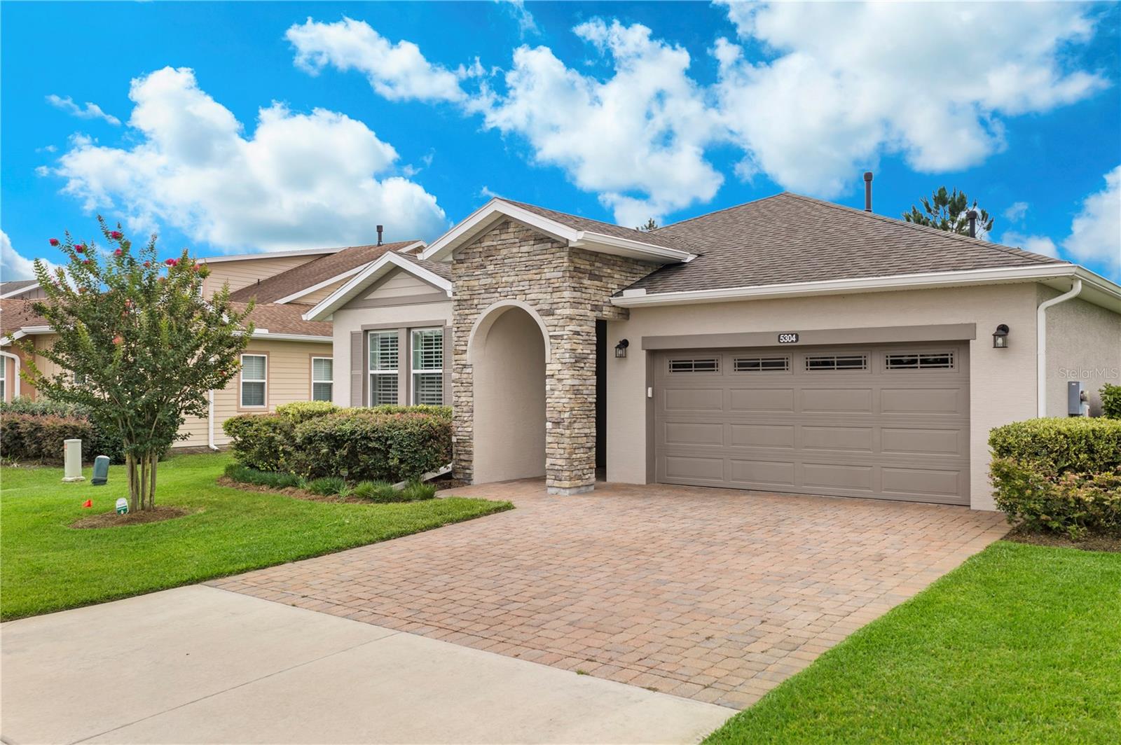 Come see this home!! pictures truly don't make any justice to it!!! Overlooking the golf course with breathtaking views and exceptional privacy, this stunning pool home Declare model in the open to all ages section of Ocala Preserve offers resort-style living at its finest. Situated on an oversized fully fenced lot, this exceptional property is also conveniently located just minutes from World Equestrian Center, offering easy access to one of the country’s premier equestrian destinations.

The backyard is a true retreat featuring a spectacular 12x24 saltwater pool with waterfall, heated by both solar and gas for year-round enjoyment. Professional landscaping and hardscaping completed in 2020, mature privacy hedges, garden lighting, expanded owner-controlled irrigation, and a natural gas stone fire pit create an outdoor setting designed for both relaxation and entertaining.

Inside, the home showcases a bright and airy open-concept design filled with natural light and sweeping golf course views. Thoughtfully designed with modern finishes and upgraded designer light fixtures throughout, the spacious living areas flow seamlessly together, creating an elegant yet comfortable atmosphere perfect for everyday living and entertaining. Plantation shutters, custom barn doors, and tile flooring throughout enhance the home’s clean and sophisticated aesthetic.

The home features 3 generously sized bedrooms and 2.5 bathrooms, including a spacious primary suite with a custom-designed walk-in closet that blends style and functionality. A roomy laundry room with built-in cabinetry adds both convenience and additional storage space. Large windows throughout the home further enhance the bright, welcoming feel of the interior.

Additional upgrades include a natural gas hookup for an outdoor grill, an interior natural gas hookup for a future fireplace, gutters, water softener system, custom garage shelving, a new garbage disposal, and a new gas hot water heater installed in March 2026.

Residents of Ocala Preserve enjoy access to exceptional resort-style amenities including a championship golf course, clubhouse, resort and lap pools, fitness center, spa, tennis and pickleball courts, walking and biking trails, dog park, onsite dining, and a vibrant calendar of social activities and events.

This meticulously maintained property perfectly combines luxury, privacy, modern comfort, and an exceptional golf course lifestyle within one of Ocala’s most sought-after communities.