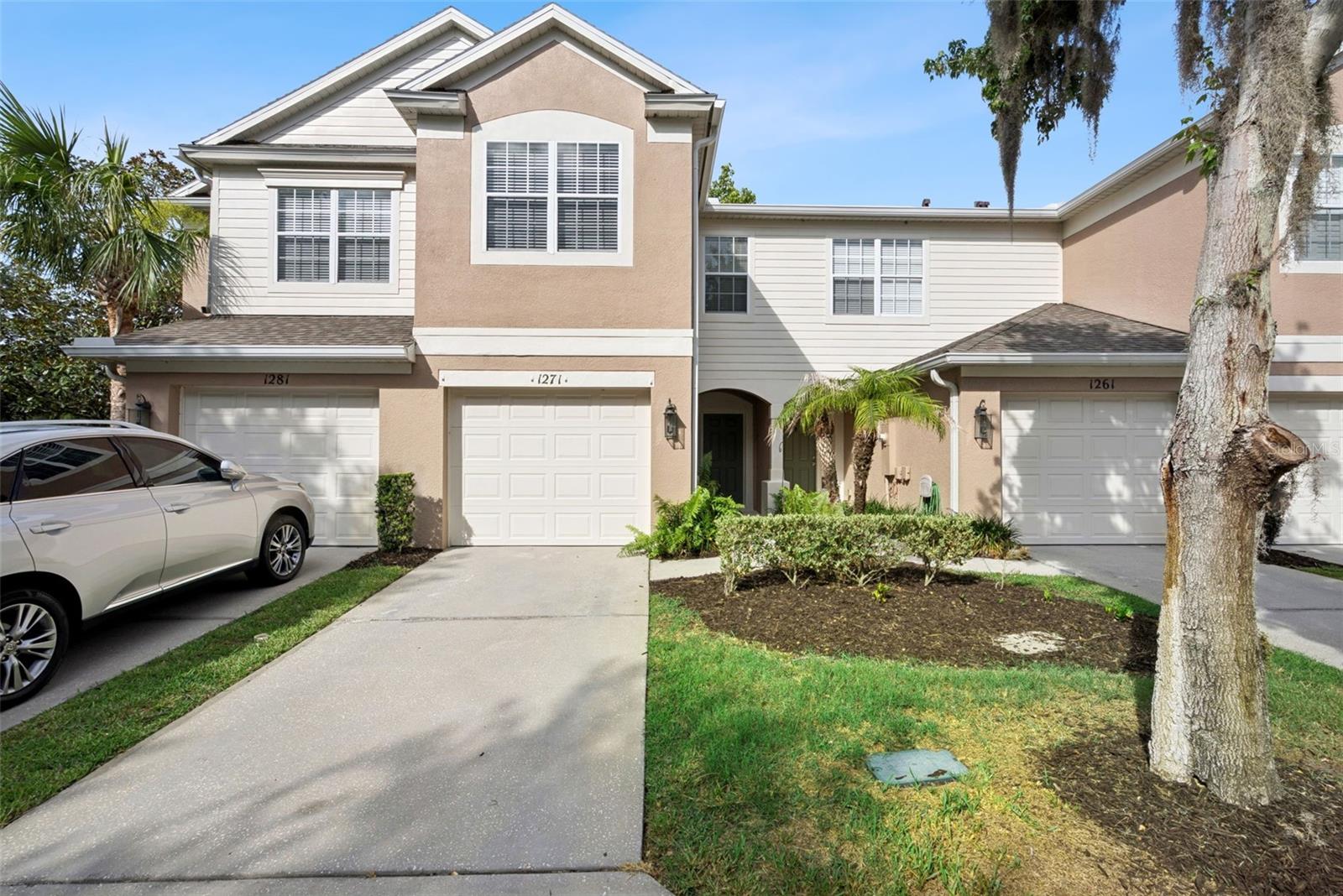 Great opportunity to own this wonderful well-priced 3/2.5/1 garage Sanford townhouse! Seller is offering this home at a lower price point as it could use a fresh coat of paint. This townhome offers comfortable, low maintenance living as your HOA includes lawn service, exterior painting, scheduled roof replacement, water, trash and sewer. The eat in kitchen has wood cabinetry, recessed lighting and a closet pantry. The combo living room/dining room is spacious. A rear screened covered patio with a pond view and no rear neighbors can be accessed through a triple sliding door off the living room. New carpeting just installed upstairs. Primary bedroom with en-suite and WIC is located upstairs with a laundry closet (that includes a washer and dryer) that separates the primary bedroom from the other two bedrooms. Roof 4/2023, AC 9/2021. Regency Oaks has gated access and a beautiful community pool with cabana. Location is prime with nearby access to major highways, popular shopping areas and restaurants and short drive to downtown Sanford, train station and Orlando-Sanford airport. Daytona and New Smyrna beaches and Theme parks are mostly within an hours drive.