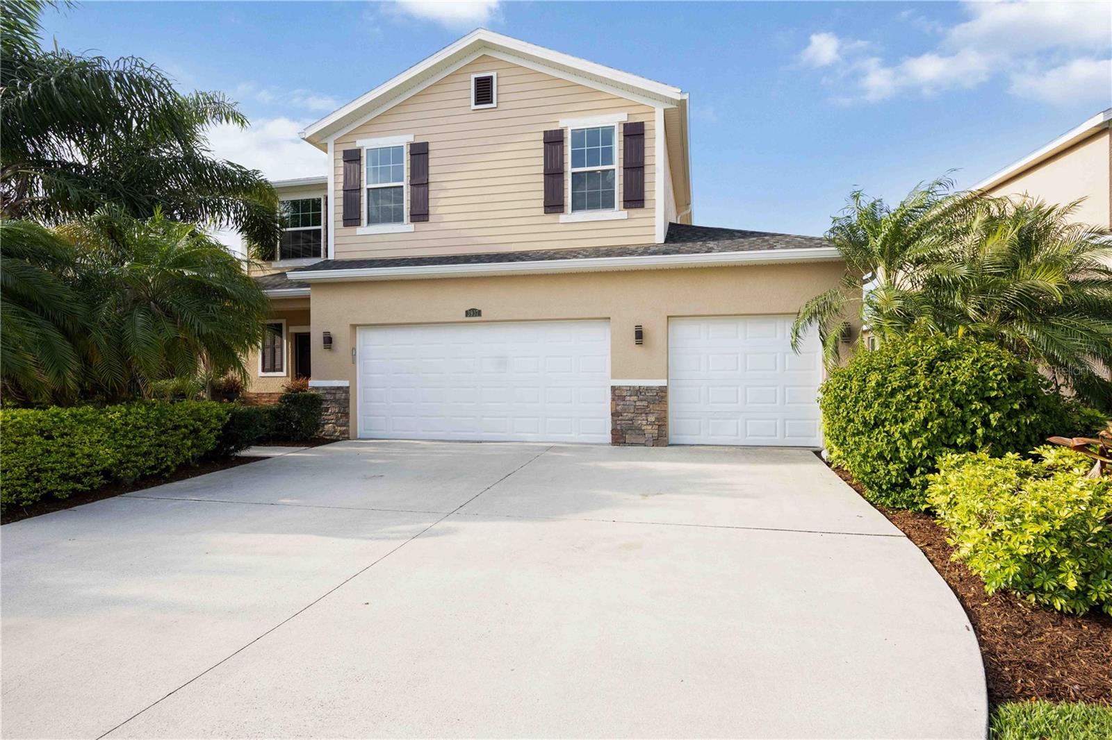 Once the model home of Covered Bridge Estates, this 2013-built 4-bed, 2.5-bath treasure stands out in every way. It’s one of the few homes offering a coveted 3-car garage—complete with its own mini-split A/C, ideal for comfort and versatility. A brand-new roof (2025), tankless water heater (2024), and updated A/C (2026) offer peace of mind.

Inside, you’ll find no carpet—sleek tile floors downstairs and luxury vinyl plank upstairs. The wide-open downstairs layout blends a granite-countered kitchen (with stainless appliances) seamlessly into a dining area, breakfast nook, and living space. Upstairs, all bedrooms are conveniently paired with an upstairs laundry room. The oversized primary suite is a true retreat, offering a spa-like bath with dual vanities, soaking tub, separate shower, and a huge walk-in closet. The loft offers a second living area—ideal for relaxation or a home office.

Outside, you’ll love the beautifully landscaped yard with mature greenery and undeniable curb appeal. The fully fenced, oversized lot features a screened in lanai and backs to a serene lake and preserve, delivering both water and nature views.

With only $85/month HOA, enjoy a heated-and-chilled pool, gym, rentable clubhouse, basketball and tennis courts, playground, and park. Ideally located near Ellenton Outlet Mall, with quick access to I-75, you’ll be moments from St. Pete, Sarasota, Anna Maria Island, and Bradenton. It’s the total package of elegance, space, and location!