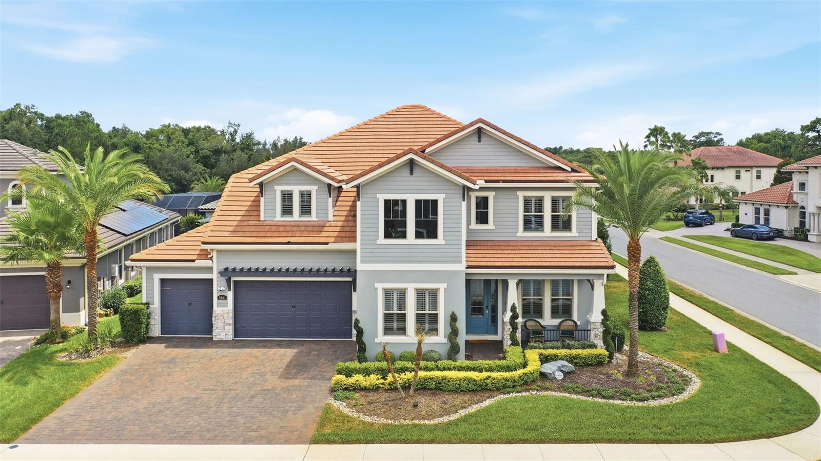 A private resort in the heart of Lake Mary, where luxury outdoor living and exceptional entertaining take center stage. Located within the highly sought-after gated community of Steeple Chase, this exceptional 4-bedroom, 3.5-bath estate offers a lifestyle rarely found in Central Florida. Designed around outdoor living and entertaining, the backyard is a true showpiece. Surrounded by mature palms, lush podocarpus hedges, and professional landscape lighting, the resort-style outdoor retreat centers around a spectacular heated saltwater pool featuring a swim-up bar, elegant fountains, a spacious sun deck, and an expansive spa with therapeutic air-jet features. Advanced pool automation provides effortless control of temperature, lighting, and water features, while programmable LED lighting allows the pool and spa to be customized with an array of colors to create the perfect ambiance for entertaining or relaxing. The spacious covered lanai with retractable screens and fully equipped summer kitchen creates an ideal setting for gatherings large and small. Whether enjoying a quiet evening by the water or hosting guests, the outdoor spaces deliver a private luxury resort experience every day. Golf enthusiasts will appreciate the home’s location just minutes from several premier golf courses, complementing the active and upscale lifestyle this community offers. Inside, soaring ceilings, abundant natural light, and a thoughtfully designed open floor plan create an immediate sense of elegance and sophistication. At the heart of the home, the gourmet chef’s kitchen showcases a premium Wolf appliance package, Sub-Zero refrigeration, natural gas cooking, custom cabinetry, an apron-front sink, and an oversized quartz island designed for both everyday living and effortless entertaining The dramatic two-story family room flows seamlessly from the kitchen and overlooks the backyard oasis, creating an inviting environment for everyday living and entertaining. A butler’s pantry and bar area connect to the formal dining room, while a dedicated office/den offers privacy and flexibility with its own staircase leading to an upstairs loft or flex space. Motorized window treatments throughout the home provide effortless comfort, privacy, and light control. The first-floor primary suite serves as a luxurious retreat, featuring tray ceilings, resort-style pool views, oversized dual walk-in closets, and a spa-inspired bath with separate vanities, an oversized walk-in shower, and a soaking tub. Upstairs, you’ll find an expansive media room or home gym featuring premium in-ceiling speakers, creating an immersive environment for workouts, movies, sports, or entertainment. A spacious game room offers dedicated wine storage and a built-in cigar humidor display, while three generously sized bedrooms are served by additional full baths. Additional highlights include an oversized laundry room with utility sink and full-size refrigerator, as well as a three-car garage. Residents of Steeple Chase enjoy the privacy and security of a gated community while remaining just minutes from top-rated schools, upscale shopping, fine dining, major highways, downtown Lake Mary, Winter Park, downtown Orlando, area beaches, and world-renowned attractions. Luxury, privacy, recreation, and resort-style living converge in one of Lake Mary’s most desirable communities. This home us a must see !! Seize the opportunity to own this slice of paradise by scheduling your private tour today!
