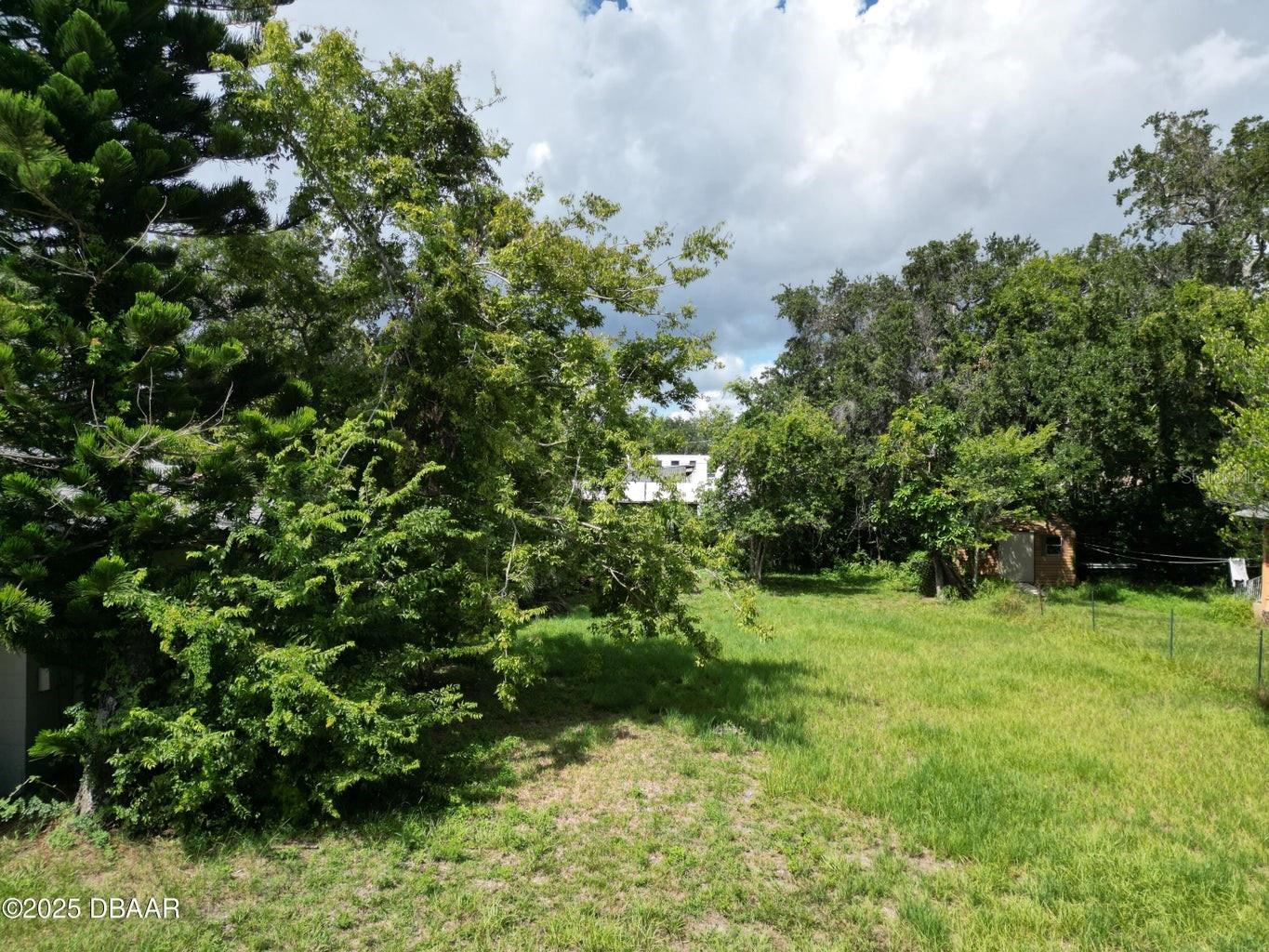 Build Your Dream Property! Discover a rare opportunity to own a ready-to-build lot in the heart of Holly Hill! This 50 x 116 ft parcel is cleared and comes complete with a survey and blueprints, saving you time and money. Located in a quiet residential area just minutes from shopping, schools, parks, and the beach, this lot is ideal for a single-family home or a long-term investment.