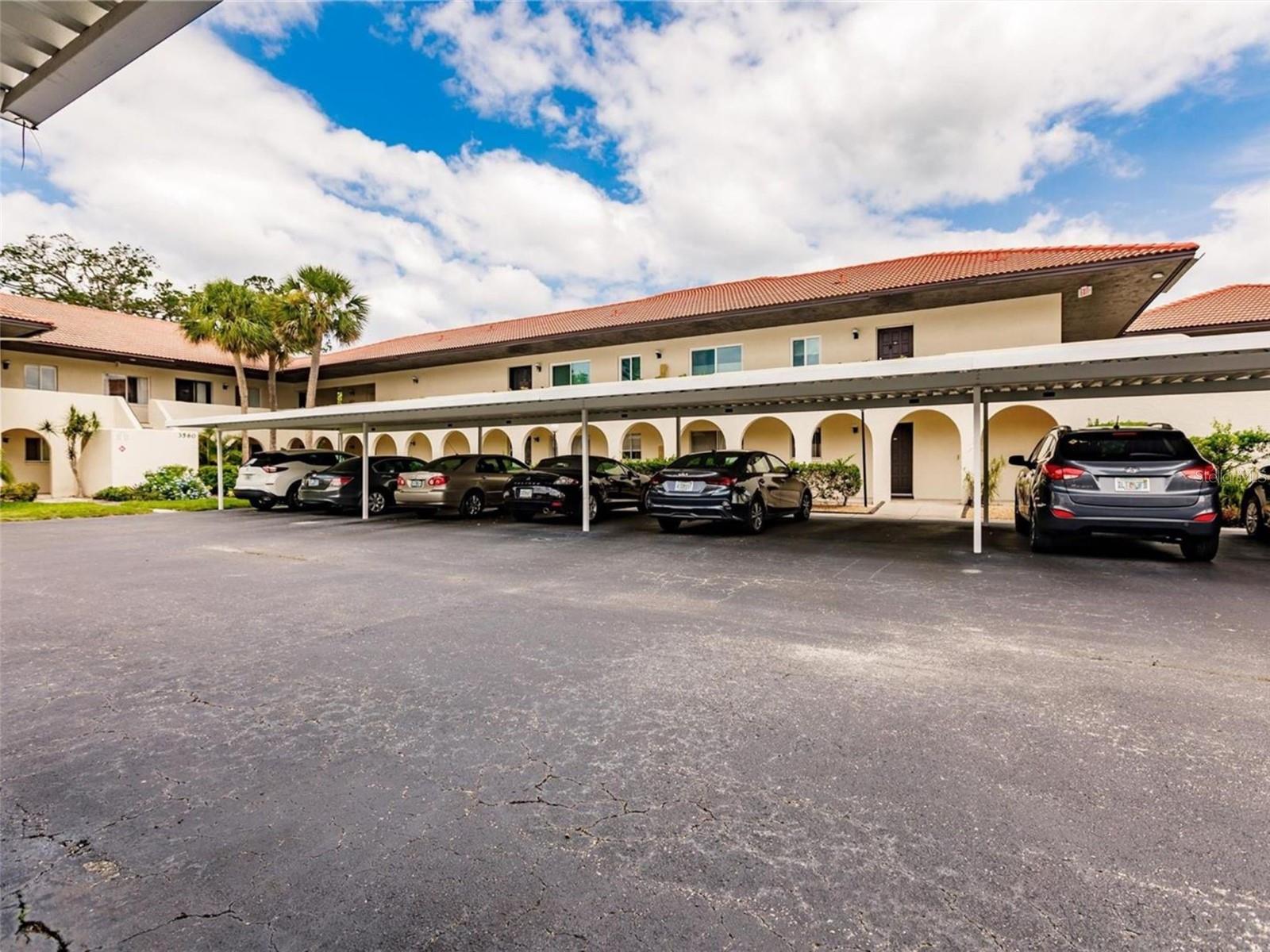 Welcome to Village Plaza, one of Sarasota’s most sought-after 55+ communities, where easy living, recreation, and a welcoming atmosphere come together. This beautifully updated, first-floor condominium offers 2 bedrooms, 1 bathroom, 857 square feet of thoughtfully designed living space, and the added convenience of covered parking. Inside, you will find tasteful updates, including attractive flooring, solid-surface kitchen countertops, and a stylishly renovated bathroom. Major mechanical updates provide added value and peace of mind, with the A/C and water heater both replaced in 2019. Natural light fills the inviting interior, while the private screened lanai provides a peaceful setting overlooking mature landscaping—perfect for enjoying your morning coffee or unwinding at the end of the day. Residents of Village Plaza enjoy an impressive array of amenities designed for an active and social lifestyle, including a heated swimming pool, clubhouse, fitness center, library, billiards room, pickleball courts, shuffleboard, and more. The community is pet-friendly and ideally situated near shopping, dining, downtown Sarasota, and the area's renowned Gulf Coast beaches. Best of all, there are no CDD fees. HOA fees include cable/internet. water, exterior maintenance, ground maintenance, escrow reserves fund, pest control, trash, sewer, and recreational facilities. Whether you're searching for a year-round residence, a winter getaway, or an investment property, this move-in-ready condo offers exceptional value in a highly desirable Sarasota location. Don't miss your opportunity to enjoy the Florida lifestyle you've been dreaming about. Schedule your private showing today and experience the comfort, convenience, and amenities of Village Plaza.