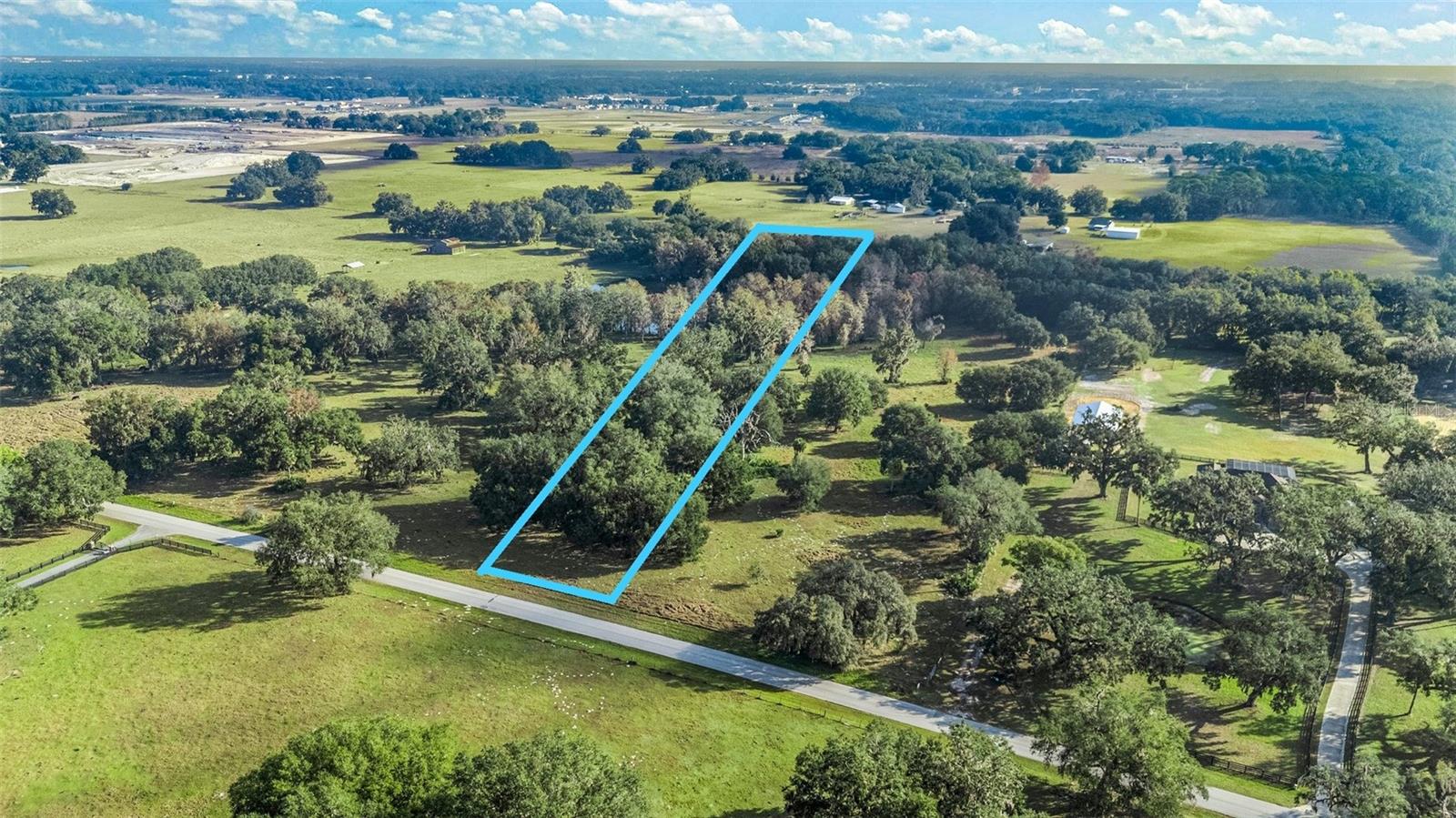 Experience the perfect mix of privacy, natural beauty, and convenience with this exceptional 6.30-acre property in Wildwood. Nestled among towering oak and hickory trees, the land offers gently rolling terrain with elevations ranging from 55 to 95 feet, creating both seclusion and endless possibilities for landscaping. Around 2.71 acres are within Flood Zone A, allowing for flexible planning and development options. Situated on a quiet side street, this property provides a tranquil rural atmosphere while still being close to everything you need. Major highways such as US 301, I-75, SR 44, and the Florida Turnpike are just minutes away, making commuting simple. The exciting new Twisted Oaks mixed-use development, less than 1.5 miles away, will introduce dining and retail options to the area. Downtown Wildwood is just 2 miles down the road, and The Villages to the east offers an array of shopping, dining, and entertainment choices. Smaller parcels like this (under 10 acres) are becoming increasingly rare. Additionally, two other parcels are available for purchase—contact us for more details (G5107949 & G5090335)!