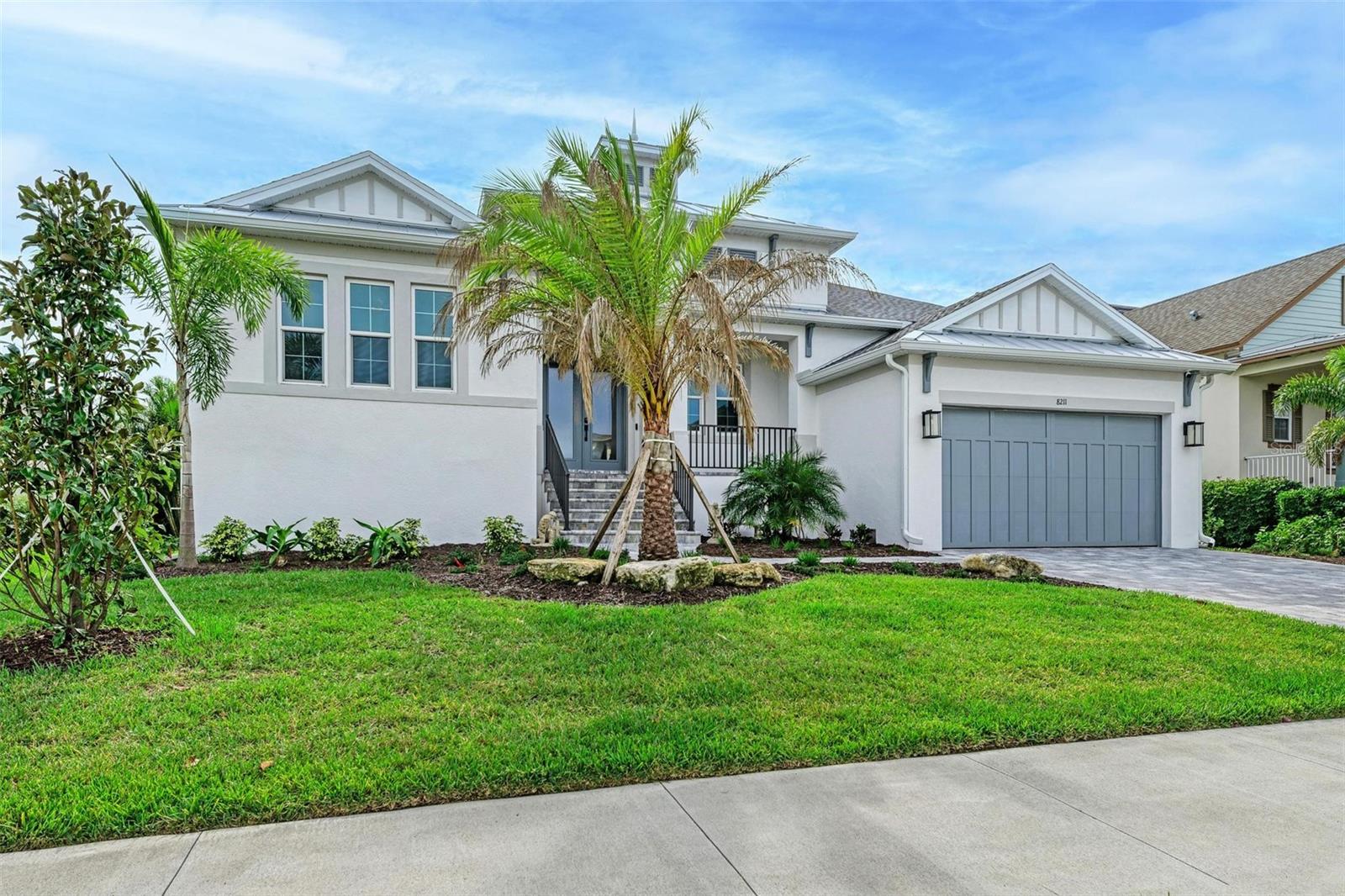 Welcome to your Florida dream home—where luxury, comfort, and entertainment come together just two miles from the stunning beaches of Anna Maria Island. Built in 2022 with hurricane rated windows and doors, meticulously maintained, this exceptional 3-bedroom, 2.5-bath residence looks and feels like its brand new.

Designed for both everyday living and unforgettable entertaining, this home features a private office and an incredible 8-seat movie theater complete with state-of-the-art audio and visual equipment and plush electric reclining chairs, creating a true cinematic experience without ever leaving your home.

The chef's kitchen is the heart of the home and this one is stunning with custom 42" cabinetry, high-end stainless steel appliances, built-in Dacor convection oven, abundant workspace, and a massive island with seating for eight—perfect for gathering with family and friends. The large pantry and laundry room were thoughtfully designed just steps away in the kitchen. The open-concept design flows effortlessly into the spacious living and dining areas, creating an inviting atmosphere throughout.

Step outside to your own private resort-style oasis featuring a heated saltwater pool, relaxing hot tub, and a custom outdoor kitchen designed for year-round Florida living. With generous seating areas and plenty of space to entertain, this backyard is ideal for hosting everything from intimate family dinners to large gatherings under the stars. 

Combining modern construction, luxury amenities, and an unbeatable location near world-famous Anna Maria Island, this extraordinary home offers the perfect blend of coastal living and elegant style. The best of all is that the sellers have already paid the assessment for the upcoming sunset/fishing dock, kayak launch, and kayak storage which will be finished soon.