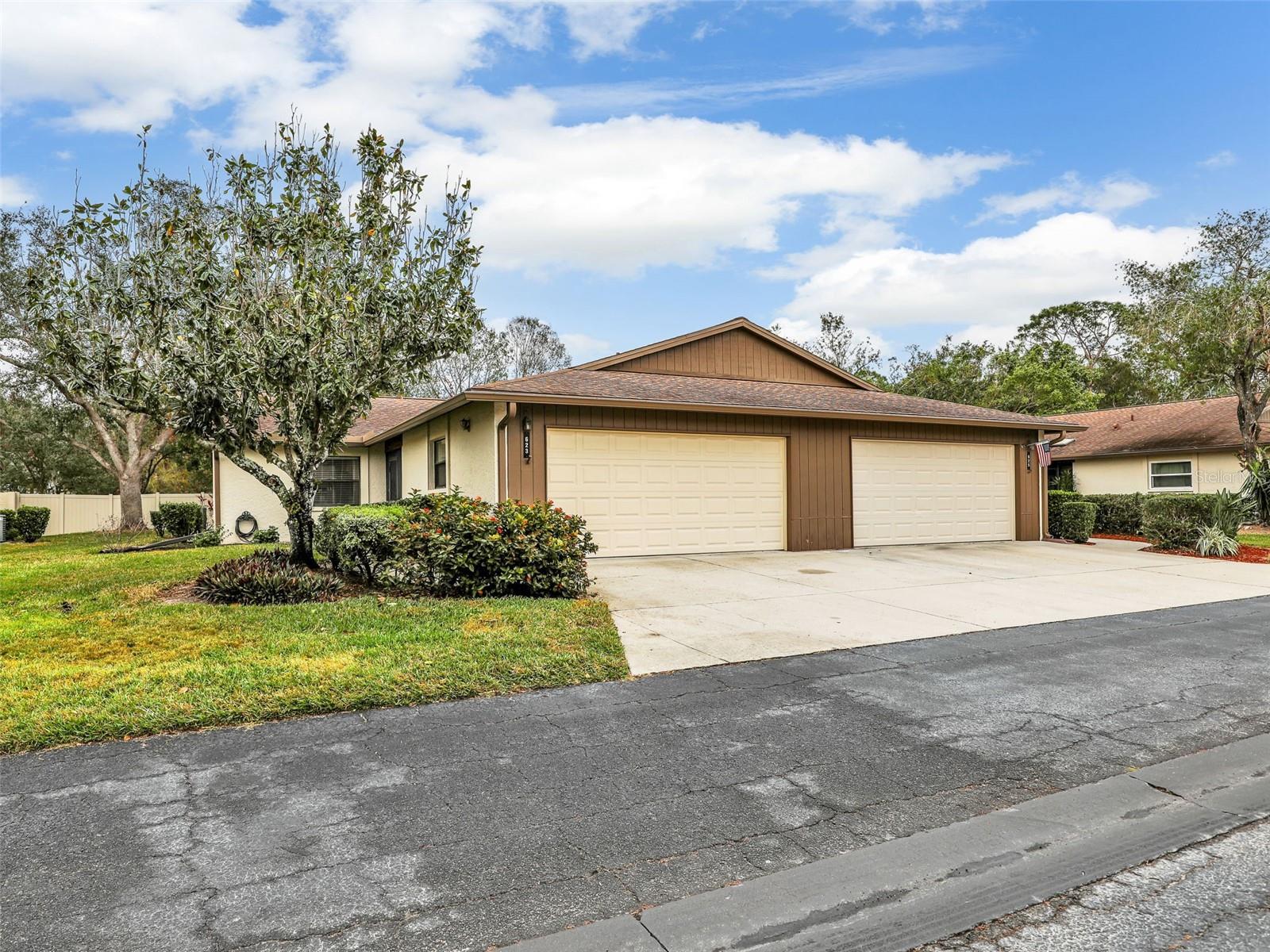 MOVE IN READY!!! BRAND NEW ROOF INSTALLED MARCH 2026!! The owner says this is the quietest place they have lived at!!! Village Oaks offers a picturesque and tranquil setting, with lush landscaping, beautifully maintained common areas, and mature trees that create a peaceful ambiance. The community is responsible for roof replacement and maintenance, as well as landscaping and the exterior walls (with the exception of windows), offering low-maintenance living and peace of mind. This beautifully updated 2-bedroom, 2-bathroom villa offers 1,451 sq. ft. of spacious and comfortable living, designed for both relaxation and entertaining. With its thoughtful layout, modern upgrades, and inviting ambiance, this home is truly a hidden gem. As you step inside, you’ll be greeted by an open and airy great room that exudes warmth and comfort. The spacious master suite is a true haven, featuring a spacious walk-in closet and private access to the sunroom, allowing you to wake up to peaceful views and plenty of natural light. The updated en-suite master bathroom boasts dual sinks, modern fixtures, and ample counter space, making your morning routine effortless. The second bedroom is generously sized featuring another spacious walk-in closet. This room is ideal for guests, a home office, or a cozy den, and is conveniently located adjacent to the updated guest bathroom, which features stylish finishes and quality craftsmanship. The kitchen has been tastefully updated with sleek quartz countertops, stainless steel appliances, abundant cabinetry, and a breakfast nook—a perfect setup for preparing meals while staying connected with family and friends. The combination of modern upgrades and functional design makes this space as practical as it is beautiful. Additional features include a Florida room, spacious 2-car garage, providing plenty of storage, and a laundry area for added convenience. A newer AC and furnace, installed less than two years ago. New remote-control fans and lights in the living area and guest bedroom. Beyond the home, residents enjoy access to fantastic amenities, including a sparkling community pool, tennis courts, and pickleball courts, perfect for staying active or simply enjoying the Florida sunshine. Located in a prime Sarasota location, this villa is just a few miles from top-rated restaurants, shopping, golf courses, and cultural attractions like the world-famous Siesta Key Beach, Lido Key, Fruitville Park and Playground, University Town Center, and St. Armands Circle. Plus, the home is situated in Flood Zone X, meaning no flood insurance is required