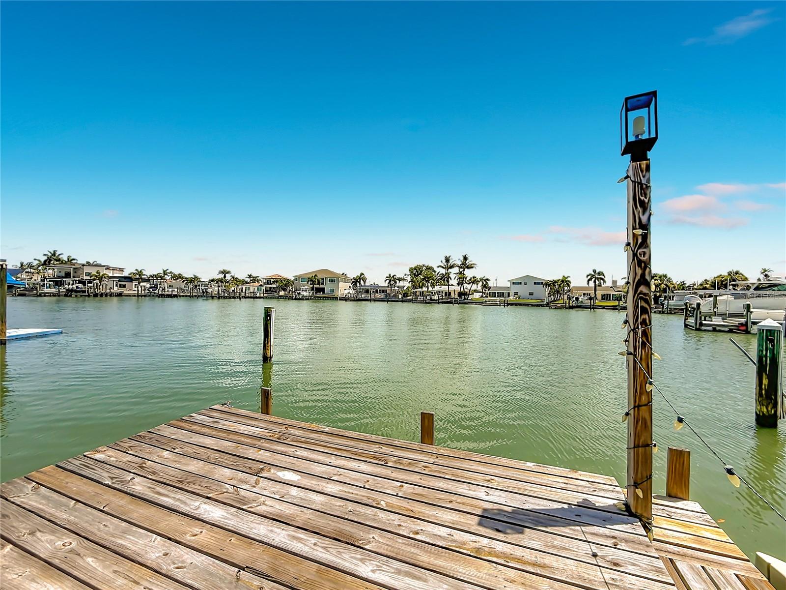 Discover the ultimate canvas for your dream waterfront lifestyle. Located in one of the area's most sought-after neighborhoods, this 1,600 square foot residence sits directly on the stunning Intracoastal Waterway, offering unparalleled views and a premium coastal experience. The property is currently being offered as a blank slate, having already undergone professional initial remediation, and is perfectly positioned for a buyer, investor, or visionary ready to customize the interior finishes to their exact personal style and preferences. The home features three spacious bedrooms and two full bathrooms, providing a functional layout that is ready for your personal touch. Outdoor living is a highlight of this property, featuring a private swimming pool perfect for cooling off while overlooking the water. Convenience is also a priority with this home, as it includes both a private garage and a separate carport, providing ample room for vehicles and storage. This property presents a rare opportunity to secure a waterfront parcel in a top-tier location at an excellent value. Bring your contractor and your design vision to complete the transformation of this coastal gem. Schedule your private tour today to see the full potential of this exceptional waterfront site.