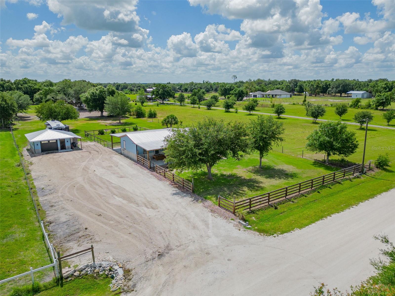 RECENT UPGRADES, NO HOA, AND TUCKED AWAY! Welcome to this beautifully Modernized 3-Bedroom, 2-Bath home situated on a well-maintained 1-acre property in the highly sought-after Ft. Ogden area of Arcadia, FL. This move-in ready 1,056 Sq. Ft. home features an Open-concept layout with extensive upgrades throughout, including New Luxury Vinyl Flooring, New Drywall and Trim, Updated Lighting and Switches, New Front and Rear Doors, and Beautifully Tiled Showers. Spacious living area is perfect for relaxing or entertaining guests. Stylish Kitchen offers plenty of cabinet and countertop space, NEW Backsplash Updates, Reverse Osmosis System, Deep Freezer for additional storage, and a convenient washer/dryer combo to maximize functionality and space. The well-appointed primary suite offers a peaceful retreat complete with a Walk-In Closet and an oversized bathroom featuring a LARGE Walk-In Tiled shower with Rain Shower Head. The split-bedroom floor plan provides added privacy, while the additional bedrooms allows flexibility for guests, family, home office space, or hobbies. One guest room even includes a built-in Murphy bed, creating the perfect multifunctional space. The secondary bathroom is also generously sized and beautifully updated. Enjoy peace of mind with a NEW ROOF on both the home and detached air-conditioned garage, complete with Storage Racks and a solar exhaust fan. Relax outdoors on the spacious 14x46 front and back porches or entertain guests at the HOT TUB area featuring a granite-wrapped bar. Additional outdoor amenities include a Private Shower, Toilet, and Sink Setup, perfect for gatherings or outdoor living. The property also includes New Septic, New Power Service, RV electric hookup, new entry steps, and updated wood fencing accents. With modern upgrades, functional outdoor features, and room to enjoy country living, this property offers the perfect blend of comfort and convenience. Schedule your private tour today!