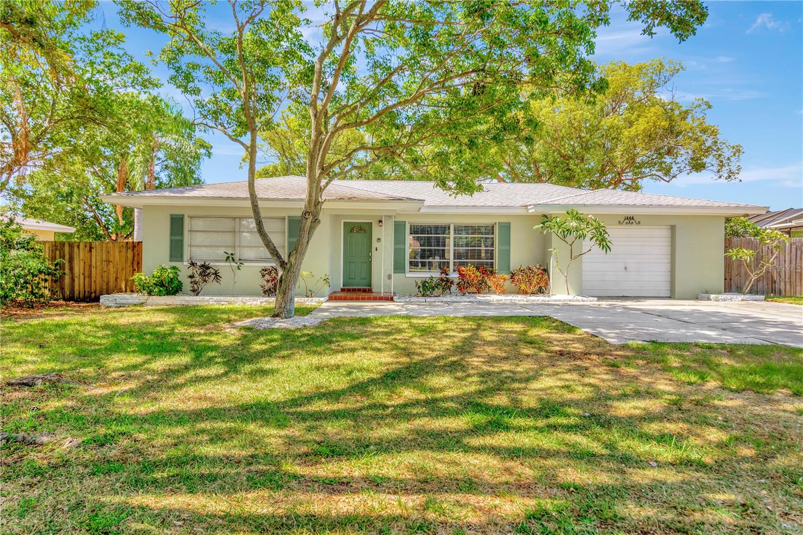 Incredible opportunity in Clearwater! This solid masonry block home offers 1,256 square feet of living space, featuring an inviting open floor plan with 2 bedrooms, 2 bathrooms, central A/C, and an attached garage. New Roof installed 2024, Pool Heater installed in 2022, Air Conditioner replaced in 2021, Wood Fence Replaced with new Vinyl fence in 2024. Step outside into your own private tropical oasis—the sprawling, oversized backyard comes complete with a stunning, heated saltwater pool and room for outdoor entertainment. Outdoor enthusiasts will love the premier location! You are positioned just 1 mile on Sunset Point Road from the famous Pinellas Trail for easy biking into Downtown Dunedin, and only 1.5 miles from the scenic Edgewater Trail along the Intracoastal Waterway.  Right down the road from top-rated schools and neighborhood parks, you are perfectly placed for coastal living with world-renowned Clearwater Beach just a short drive away.