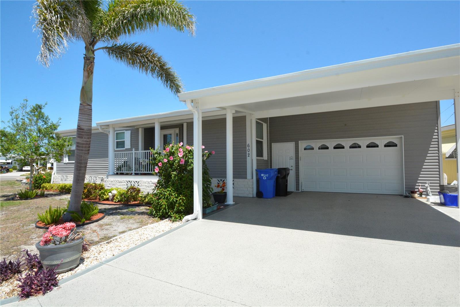 This is a turnkey Home, move inn ready, 3 Bedroom / 2 Bath at the Country Club Estates 55+ community in Venice Island. Build in 2107 home is 1782 sq ft under air making it one of the larger homes at CCE. It features many upgrades including Sun tunnel skylight throughout, large great room (26’x19’), indoor laundry room with washer and dryer included, large main bedroom and bath with walk in shower and separate garden tub, brand new King size mattress. The back bedroom has 2 new twin beds and mattresses and linens. The 3rd bedroom has a pull out queen bed/bedding. The nice enclose porch in the back of the house has a separate A/C & Heating unit for comfort. This property sits on one of the largest lots in CCE. It has a long garage (32’X15') with a back door for a golf car, it has ample storage shelves and the stairs to the house from the garage have been rebuild to half steps for easer access. Nicely landscape, including a flag poll and irrigation system. Home is near Venice beach. Amenities include, shuffle board, pickleball, pool, jacuzzi, fitness center and Clubhouse for community activities.