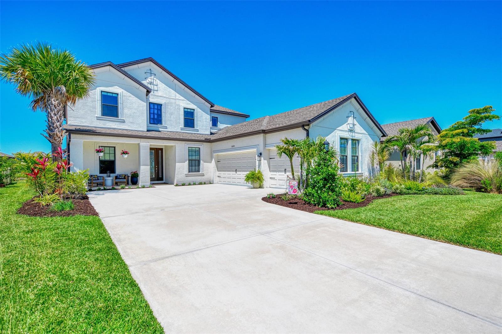 PRICE REDUCED! Enjoy the Florida life under glowing sunset skies and serene lake views in this luxury 5 bedroom plus office, 4.5 bath, 3-car garage, HEATED SALTWATER POOL home with 3,847 square feet of interior living space and a stunning outdoor pool area that your friends and family will envy. * High-end touches include wood-look luxury laminate flooring, picture-frame and crown molding, designer lighting, and a spacious great room with a coffered ceiling. The gourmet kitchen features a large island with quartz counters, 5 burner gas cooktop with a pot filler and vented hood, French door refrigerator, double ovens (including one with an easy-open French door), a scullery/butler's pantry with wine fridge, and a walk-in pantry. The main-floor primary suite offers a custom dream closet that brilliantly connects to the laundry room and a spa-like bathroom with enormous walk-in shower and dual vanities. There is a beautiful powder room for guests, and the floorplan is both open while still having zones for privacy, including an office with French doors, a formal dining room/library, and a breakfast nook. * Upstairs, you'll enjoy a LARGE LOFT that makes for a perfect playroom, workout space, gaming lounge, or man cave. It's surrounded by four additional bedrooms (including two en suites) to create flexible space for guests and family, work, and play, with no carpet in common areas and brand-new carpet in upstairs bedrooms for comfort. * 

Outside, the heated saltwater pool and pavered patio are straight out of a magazine, with a dramatic 360-degree cascading spa, sunshelf, a water feature, bubblers, and umbrella holder. The shaded area features a full outdoor kitchen with a Napoleon grill, vented hood, and gorgeous backsplash, and it is enhanced by pocketing sliders for seamless indoor-outdoor living. * THIS HOME FEATURES A THREE CAR GARAGE, AND A LARGE DRIVEWAY TO ACCOMMODATE YOUR FRIENDS AND FAMILY! **

The Skye Ranch community is gated and has one of the nicest amenity centers (The HUB) in the area, featuring a resort style pool, a lap pool, fitness center, climbing wall, numerous social spaces (including a kids' lounge), an air-conditioned gymnasium, and a coffee bar. This home and neighborhood are just a quick bike or golf cart ride to the brand new districted K-8 school, Skye Ranch School; and Sarasota Suncoast Academy, The Classical Academy, and Out of Door Academy Lower Campus are also just minutes away. This community is wonderful for all ages and the house is completely move-in ready, so schedule your showing before this one gets away!