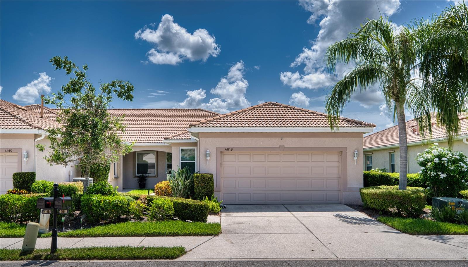 Priced to sell!!Welcome to  the 55+ community of Lakeridge Falls.   This 2 bedroom plus den end unit quad is ready for you to enjoy Florida living at its finest!  - IMPACT windows allow for peace of mind if you are traveling, or in town. The location is perfect -with a pond view- Eastern exposure to enjoy your morning coffee as the sun comes up and the ducks and birds swim around. Laminate Flooring in all but the primary bedroom allows for easy care- and time for swimming in the beautiful clubhouse pool, and participating in activities. Walkable to Panera's, Publix and more, Lakeridge falls is close to downtown, the beautiful beaches, UTC mall, & I75. Close to everything - But away from it all!