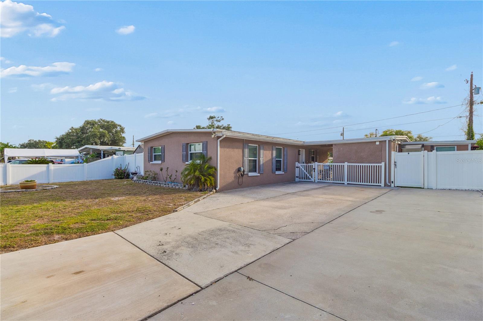 Welcome to this one-of-a-kind, completely transformed property in Clair Mel City, where modern living meets incredible financial opportunity. This beautifully updated block home sits on a massive lot and offers a unique setup perfect for buyers looking for a premium primary residence, multi-generational living, or an instant house-hacking income stream!.All major systems (Roof, AC, electrical panel, impact-resistant windows, doors, lights, and vanities) were completely replaced with full Hillsborough County permits, offering the worry-free lifestyle of a new construction home.Completely updated flooring with modern tile throughout (no carpet!), stylish kitchen cabinets, beautiful backsplash, an expansive island, and newer stainless steel appliances—including a refrigerator less than a year old.Attached right next to the laundry area, you will find the  In-Law/Airbnb Suite with its own private independent entrance. This suite comes fully equipped and completely furnished (everything included!), ready to start generating income or hosting guests from day one.The backyard is an absolute showstopper and a true tropical paradise! Fully enclosed by a PVC privacy fence, the outdoor space features:A massive, professionally poured concrete patio.A spectacular, fully covered outdoor kitchen and custom cabana/barbecue area perfect for hosting epic family gatherings.A lush, mature orchard featuring an abundance of fruit trees, including mango, pomegranate (granada), guava, orange, and avocado.Extra storage with a detached backyard shed.Bring your toys! The oversized driveway provides ample parking for up to 6 vehicles, a large boat, or an RV. Strategically located with lightning-fast access to the Selmon Expressway and I-75, making your commute a breeze to Downtown Tampa, Ybor City, Brandon, and the Westfield Mall.
Properties with this level of detail, outdoor luxury, and immediate income potential rarely hit the market in this price range. Schedule your private tour today before it’s gone!