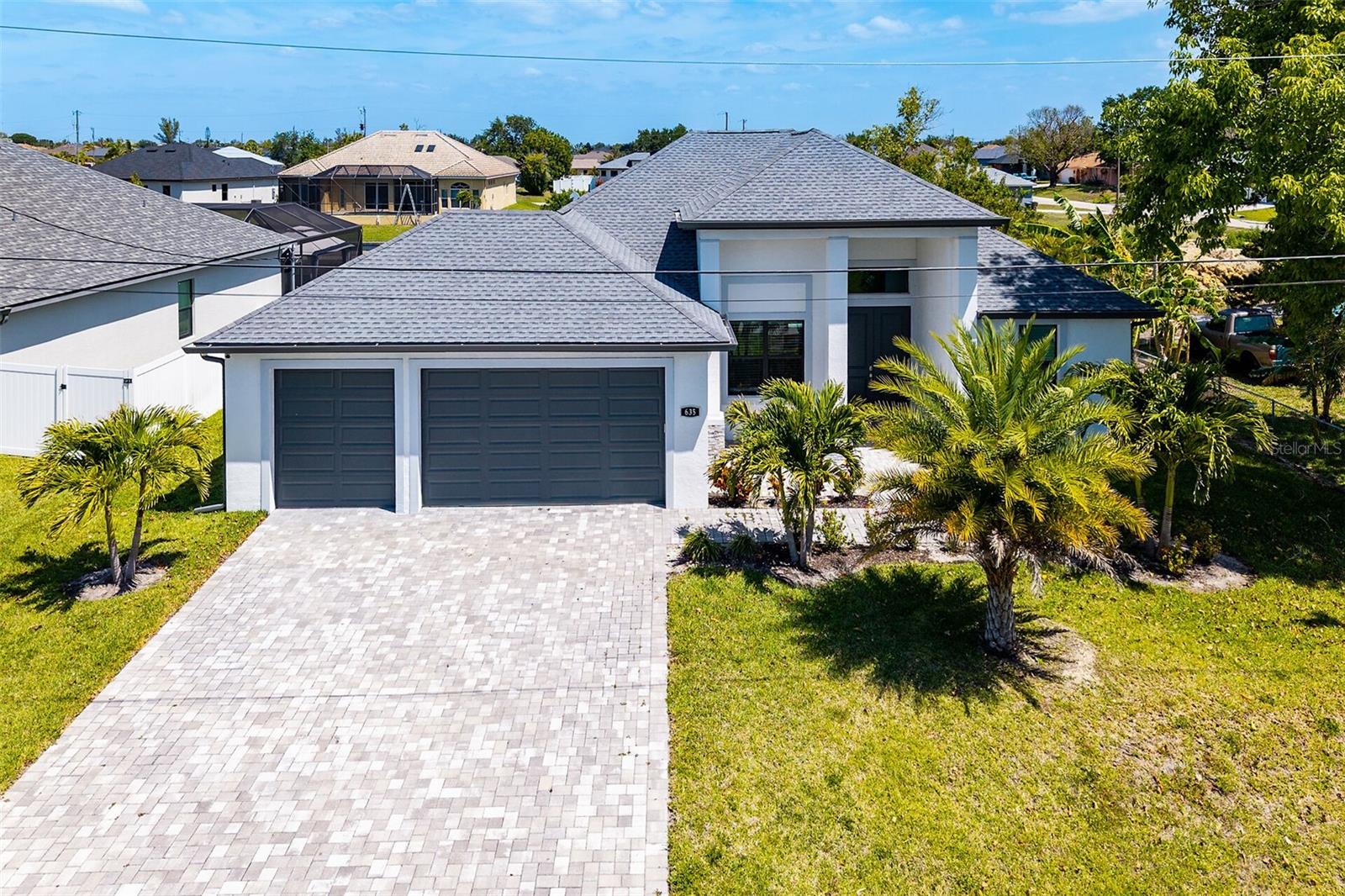 Virtually Staged. Your Florida Dream Home Awaits Built in 2023 and impeccably maintained, this stunning 4-bedroom, 2-bath home offers the perfect blend of comfort, style, and lifestyle. Wake up to peaceful water views and unwind each evening in your heated saltwater pool as the sun sets over the canal and lake—your own private slice of paradise. Inside, you’ll love the open-concept design with soaring 11-foot ceilings and a spacious, upgraded kitchen featuring granite countertops, 42” shaker cabinets, stainless steel appliances, and a wine cooler—perfect for entertaining or quiet nights at home. The primary suite is your personal retreat, complete with dual walk-in closets and a spa-like bath with double vanities and a walk-in shower. Whether you need space for guests or a home office, the flexible 4th bedroom adapts to your needs. A 3-car garage provides plenty of room for storage, hobbies, or recreational gear. No HOA. No rental restrictions. Proven income potential. Whether you're looking for a full-time residence, vacation getaway, or investment opportunity—this home checks every box. Owner financing available.