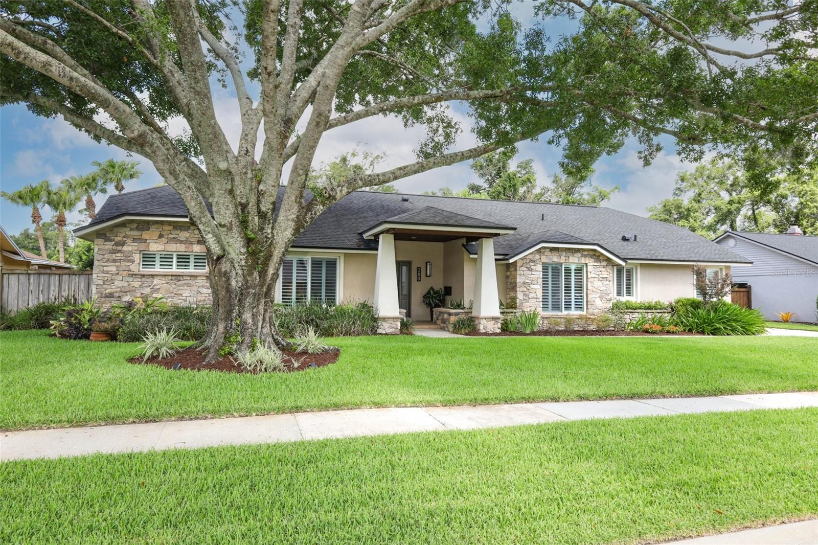 Welcome to a truly one-of-a-kind custom home where timeless craftsmanship meets over two decades of thoughtful, high-quality renovations. From the moment you arrive, the striking stone façade, architecturally designed front porch, and beautifully landscaped grounds create an unforgettable first impression.
Inside, nearly every room has been transformed with premium finishes and meticulous attention to detail. The spectacular 2025 chef's kitchen is the centerpiece of the home, featuring custom Fabuwood cabinetry, quartz countertops, an impressive 4' x 7' island, marble backsplash, coffee bar, under-cabinet lighting, and an exceptional suite of luxury appliances including a 42" Sub-Zero built-in refrigerator, GE Monogram induction cooktop, wall oven and Speed Cook oven, Bosch dishwasher, and custom vent hood. A built-in banquet with hidden storage creates the perfect space for casual dining and entertaining.
The luxurious primary suite offers a beautifully renovated spa-inspired bath with travertine stone, jetted tub, oversized glass shower, granite dual-sink vanity, Toto fixtures, and an expanded custom walk-in closet. The secondary bathrooms have also been tastefully renovated with designer finishes, quartz countertops, frameless glass shower enclosures, and premium fixtures.
 
Quality improvements extend throughout the home, including Pella double-pane, argon-filled, impact-resistant windows and sliding doors, solid-core interior doors, custom trim, crown molding, custom built-in office cabinetry, updated flooring, fresh interior paint, modern lighting, and upgraded electrical throughout.
Major mechanical updates provide outstanding peace of mind, including water heater (2026) two Lennox 16-SEER HVAC systems (2019), Eaton electrical panels (2018), a 2020 architectural shingle roof with transferable 50-year warranty, four energy-efficient skylights, upgraded aluminum soffits, and two newer Rheem water heaters.
 
Step outside to your private backyard retreat featuring a completely renovated saltwater pool with glass tile, waterfall feature, expanded paver decking, Hayward variable-speed pump, new irrigation system, updated fencing, professional landscape redesign, and extensive outdoor lighting—creating the perfect setting for relaxing or entertaining year-round.
 
This guard-gated neighborhood also features ball fields, tennis, basketball and pickleball all within sites view of your front door.
 
This exceptional custom home combines luxury, quality construction, and an extraordinary list of upgrades that would be difficult to replicate today. Every improvement has been completed by licensed contractors, making this a rare opportunity to own a meticulously maintained, move-in-ready residence where virtually every major component already been updated.