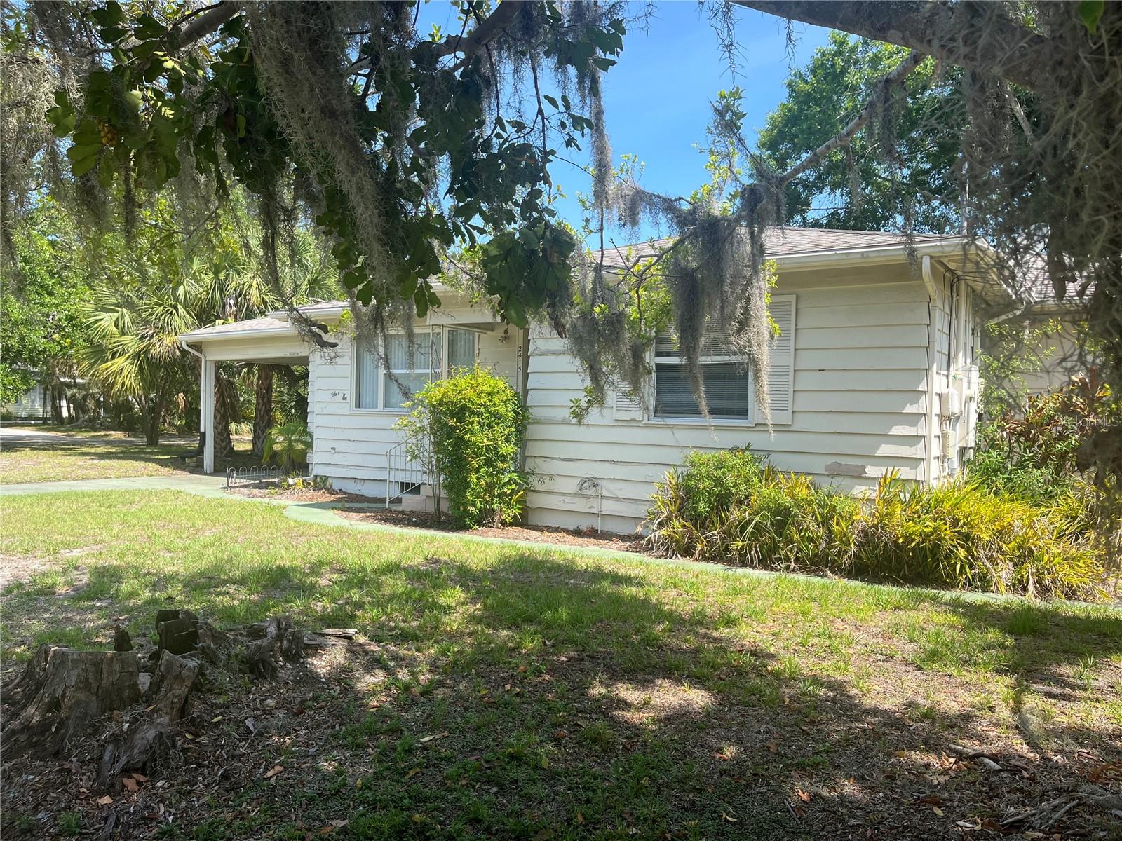 Charming 1950s Florida Ranch-Style Home with Separate One-Bedroom Apartment in Sought-After Terrace Gardens!  Don’t miss this rare opportunity to own a classic mid-century Florida ranch home in the desirable Terrace Gardens community. Situated on an expansive corner lot, this single-family residence offers exceptional flexibility, income potential, and future development possibilities.

The main home features 2 bedrooms and 1 bath, showcasing original wood floors in the bedrooms, generously sized closets, and a delightful lanai-style sitting room perfect for relaxing. A beautifully carved-out one-bedroom, one-bath apartment provides a private space ideal for guests, extended family, or rental income—both units are currently rented.

Whether you're looking to generate income immediately or envision building your dream home in a neighborhood filled with new construction, this property offers endless possibilities. Enjoy the unbeatable location: bike the nearby Legacy Trail, explore downtown’s vibrant restaurants and cultural scene, play at Payne Park, or spend the day at the beach—all just minutes away.