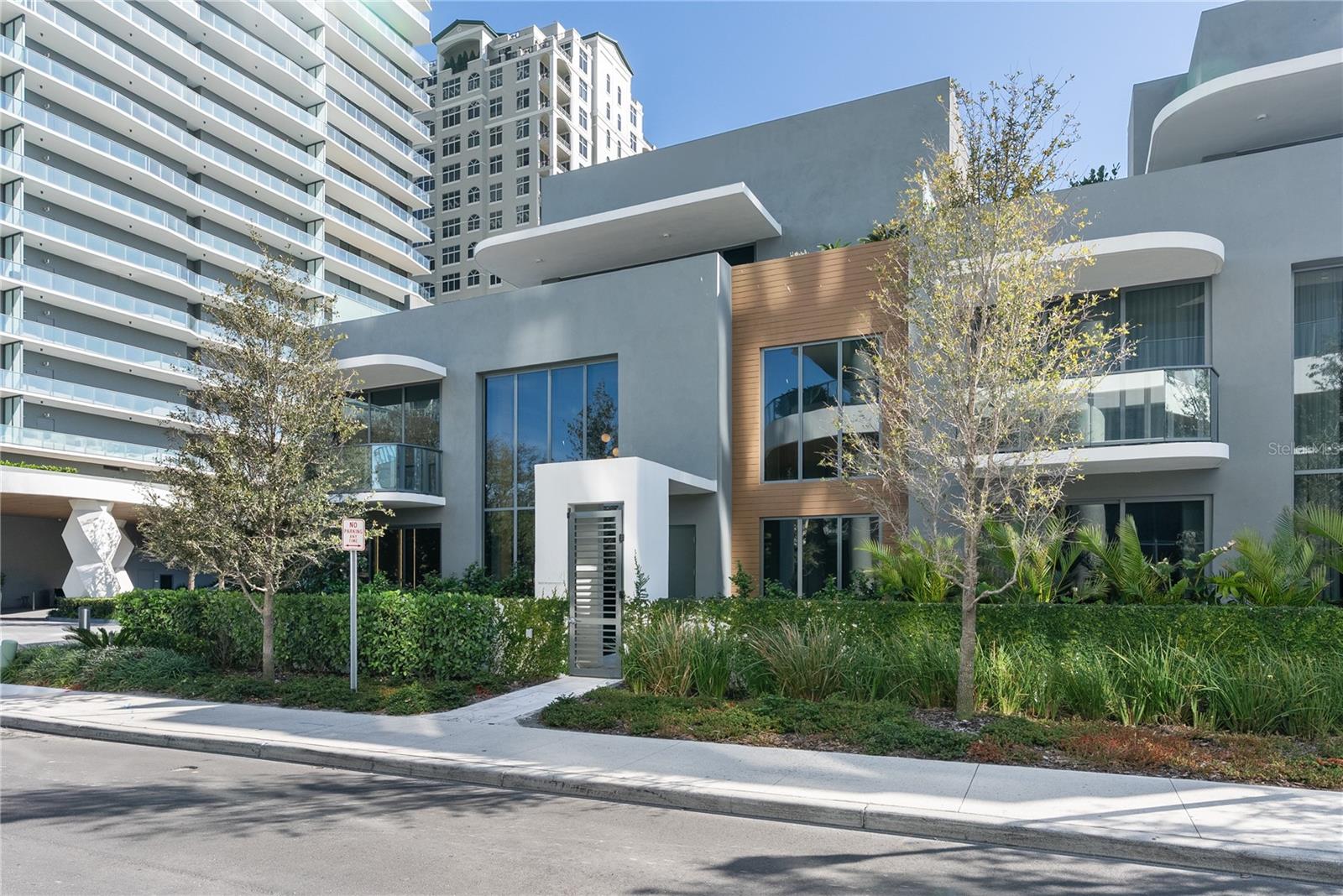 Now available, this extraordinary three-story townhome within The Ritz-Carlton Residences, Tampa offers a rare opportunity to own one of the most highly customized residences just moments from iconic Bayshore Boulevard. Encompassing 3,699 square feet, this impeccably designed three-bedroom villa delivers the scale and privacy of a single-family home, paired with the unparalleled service and
amenities synonymous with Ritz-Carlton living. The residence includes two dedicated parking spaces, along with 24-hour concierge and valet services. Thoughtfully designed across three levels, the home features four full bathrooms and one powder bath. The third-floor loft serves as a sophisticated entertaining retreat, complete with a Bosch packaged kitchen and bathroom—ideal for hosting or creating a
secluded private suite. A private rooftop terrace crowns the residence, showcasing an outdoor kitchen, spa,
and sweeping views of Bayshore Boulevard. Enhancing its exclusivity, the home offers direct access from the residence to the resort-style pool deck, seamlessly blending privacy with effortless indoor-outdoor living. The interiors have been meticulously elevated with bespoke finishes, including custom bamboo charcoal wall panels that provide architectural richness while enhancing air quality, insulation, and acoustic comfort. Refined built-in millwork, crafted from humidity-resistant materials, delivers both durability and a flawless, tailored aesthetic throughout. Imported Hisa flooring from Israel lends natural sophistication underfoot, while a sleek bioethanol fireplace creates a warm, modern ambiance. The third-floor kitchenette is appointed with premium Bosch appliances, further elevating the functionality of the
entertainment level. Residents enjoy access to curated amenities on the first and second floors, complemented by the legendary Ritz-Carlton service experience—offering a seamless blend of privacy, elevated design, and world-class hospitality.