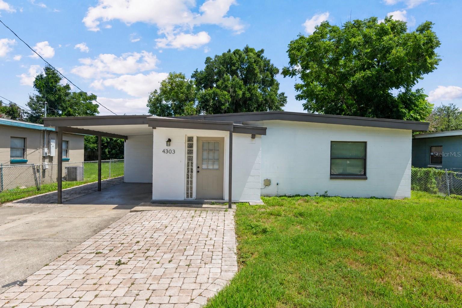 Virtually Staged. Welcome to 4303 Anderson Rd — a centrally located 3-bedroom, 2-bath home in Orlando’s highly desirable Conway/32812 area. Offering 1,444 square feet of living space on a 7,112-square-foot lot, this home provides a comfortable and flexible layout with plenty of room to make it your own. Best of all, there is no HOA and the roof is only approximately 5 years old.

One of the home’s most appealing features is its versatile floorplan. The primary bedroom area is positioned near a separate living room with kitchenette, creating an ideal setup for a private primary suite, multigenerational living, guests, a home office, or potential rental flexibility. The layout offers the possibility of using the home as a traditional 2-bedroom, 1-bath residence with a separate private 1-bedroom, 1-bath-style living area. The laundry room has its own rear entrance, and both living areas have convenient access to the laundry room and backyard.

Outside, enjoy a large backyard with plenty of space to relax, entertain, garden, or create your ideal outdoor retreat. The spacious covered back patio is perfect for grilling, outdoor dining, or unwinding in the shade. A large backyard shed provides excellent storage for tools, equipment, and more, while the carport adds convenient covered parking.

Built in 1957 and located in an established neighborhood, this home is zoned for highly desirable Boone High School and offers convenient access to downtown Orlando, Orlando International Airport, major roadways, shopping, dining, and local schools. Whether you are looking for a place to call home, extra privacy for family or guests, or a property with added flexibility, this is a great opportunity in one of Orlando’s most sought-after areas.

Traditional Owner financing or Lease to Own will be considered with acceptable terms. Buyer to verify all potential uses, rental options, zoning, permitting, and room configurations.
