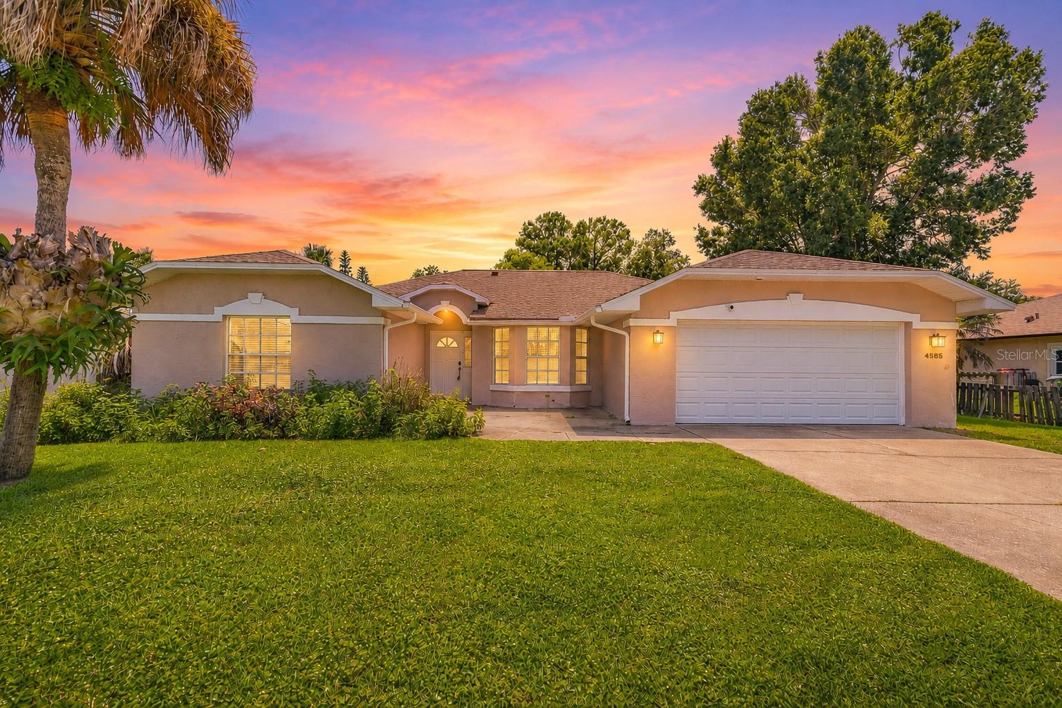 NEW ROOF TO BE INSTALLED PRIOR TO CLOSING! Welcome to 4585 Miles Drive in Port Orange! This beautifully updated 4-bedroom, 2-bathroom home offers a wonderful combination of comfort, functionality, and convenience in a desirable location.

Step inside to discover brand-new luxury vinyl flooring throughout the entire home, complemented by a fresh interior paint job that creates a clean, bright, and inviting atmosphere. Major updates include a newer A/C system installed in 2025 and a water heater replaced in 2022, providing added peace of mind for the next homeowner.

One of the home's standout features is the spacious enclosed rear porch, equipped with glass sliding windows, creating a versatile space that can be enjoyed year-round as an additional living area, entertaining space, home office, or peaceful retreat. The property also features a wrought iron fence installed in 2022, offering privacy and security while enhancing the home's curb appeal.

Located in a convenient area near shopping plazas, hospitals, beautiful beaches, and the NASCAR tracks, this home offers easy access to many of the amenities and attractions that make the Port Orange area so desirable. Families will also appreciate the great school zones.

With its spacious layout, numerous updates, enclosed rear porch, and a new roof to be installed prior to closing, 4585 Miles Drive is a home you won't want to miss!