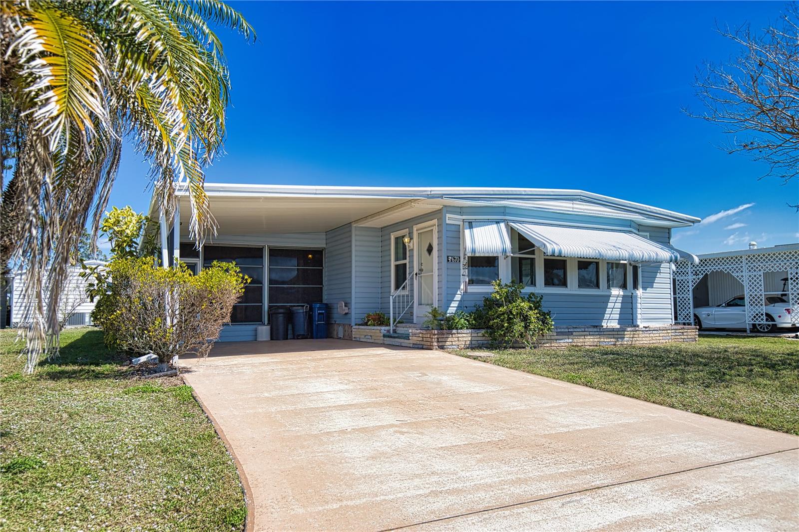 Embrace the Florida dream lifestyle in this charming home, located on a quiet street in this vibrant 55+ community. Inside, the house feels open, featuring a kitchen/dining room combination that flows into a comfortable living room, making it perfect for entertaining. The kitchen features Corian countertops and updated cabinets which match the updated dining room built ins. The front family room is an ideal spot for a home office, or crafting room. Retreat to the sanctuary of the primary bedroom, which includes an ensuite bath with a walk-in shower. The guest bedroom is designed to make your visitors feel welcome, with a convenient bathroom located just outside the door. It's a perfect opportunity to update, personalize, and truly live the Florida dream. Recent updates include a new vapor barrier (2022), a new metal roof (2024) new windows, an A/C unit (approximately 2021) with an extended warranty until 2029., a new carport roof (2024), and a new lanai (2024). Discover the enchanting community of La Casa, where 974 stunning homes are elegantly nestled among a tapestry of native trees, offering a serene escape surrounded by spacious common areas and eight picturesque lakes. Our generous lots average an impressive 60 by 80 feet, providing ample space for your dream home. Perfectly situated between Sarasota and Fort Myers, La Casa embodies the ultimate lifestyle on Florida’s Gulf Coast—a true boaters paradise with direct access to the breathtaking Gulf of Mexico. Enjoy the convenience of nearby shopping, exciting sightseeing, world-class golfing, and abundant fishing and boating opportunities, all while indulging in the rich culture and refined elegance that Southwest Florida is celebrated for. As you immerse yourself in the warmth of Southwest Florida’s winters, you’ll find yourself in a relaxed and unhurried atmosphere, far removed from the hustle and bustle of the east coast. Our community is adorned with lush, mature landscaping that reflects the loving care both residents and management dedicate to preserving its beauty. At La Casa, you’ll discover some of the finest pools in the area. Our crowning jewel is a magnificent 40 by 60-foot swimming pool, maintained at a perfectly inviting 87 degrees. Just a short stroll away, you’ll find our cozy 20 by 40-foot pool, nestled charmingly between the clubhouse and the Activity Building. Both pools feature adjacent hot tubs, ideal for unwinding after a refreshing day of golf or an invigorating game of tennis. Stay connected while basking in the sun with our complimentary wireless Internet (Wi-Fi), available at the Clubhouse, Activity Building, and Recreation Hall. Whether you’re catching some rays or catching up on emails, La Casa has it all. Does this sound appealing? La Casa is not just a community; it’s a welcoming family-friendly haven.  Enjoy the tranquility of your surroundings, with the vibrant energy of nearby attractions just a heartbeat away. Come visit our charming self-contained oasis and experience firsthand why La Casa is the ultimate destination for snowbirds and year-round residents alike!