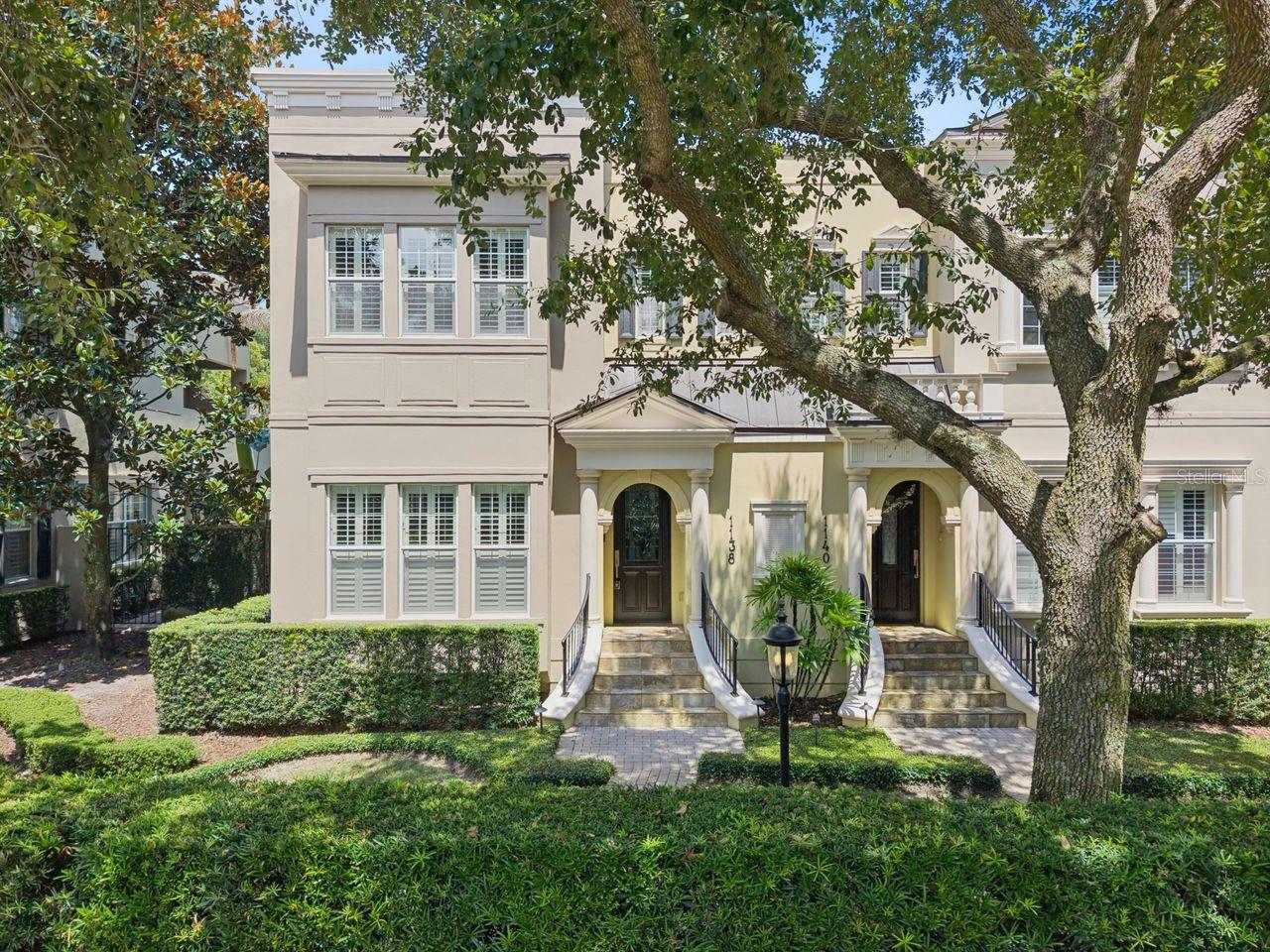 Georgetown-style 'Brownstown' in the Heart of Winter Park, walking distance to Downtown, PLUS deeded Lake Access to Lake Virginia! This spacious property has 3 bedrooms, 3 full baths, 2434 sq ft, 10' ceilings custom details throughout and natural lighting. Foyer with slate flooring, enjoy the double-sided gas fireplace in the Living & Dining areas, beautiful wood floors, crown molding, plantation shutters, a butler bar with custom cabinetry & wine refrigerator. Cooking inspired Kitchen with a lengthy granite island and sitting bar overlooks the Family room. Upgraded stainless appliances, including gas cooktop with griddle, microwave/convection oven, hanging pot rack with lighting, and soft close cabinets with pullouts. French doors to the covered 'English Garden' courtyard with pavers & stainless grill for entertaining. Guest suite or home office with a custom closet and full bath overlooks brick street, Pennsylvania Ave. Large laundry room near the garage with granite countertops, cabinets & utility sink, plus washer & dryer. Upstairs is a spacious Primary bedroom with French doors to a private covered balcony; also, 2 large walk-in closets with closet systems, Jacuzzi tub, huge walk-in shower, dual vanities with granite countertops & more. An additional ensuite bedroom, more wood floors, plus a built-in dehumidifier. Attached 2-car, rear alley access garage, plus an additional side parking pad. Walk to Park Ave. for dining, shopping, WP Tennis Center, outdoor park & Rollins College. Neighborhood Lake Virginia access for paddleboard & kayak launching to the Winter Park Chain of Lakes. Top schools, Audubon K-8 seconds away, and WPHS. NEW TPO membrane roof w/ metal coping March 2026. HOA maintains: landscaping, irrigation, building maintenance & outdoor lighting. Won't last!