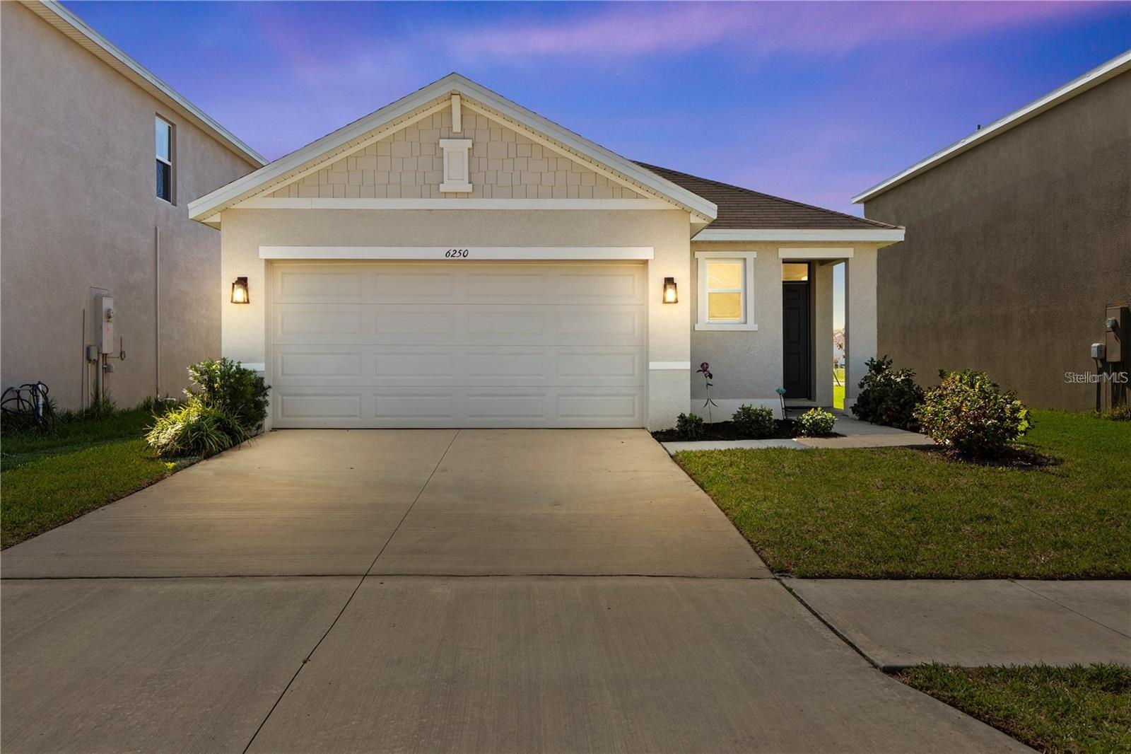 Built in 2024 and impeccably maintained, this move-in-ready Avalon Park home offers the advantages of new construction without the wait or added upgrade costs. Thoughtfully enhanced with smart home technology, whole-home water softener, reverse osmosis filtration, UV air purification, leak detection, granite countertops, stainless steel appliances, and designer finishes, it's ready to enjoy from day one.

The open-concept layout features spacious living and dining areas, a versatile flex room ideal for a home office or playroom, and a private primary suite with a large walk-in closet, dual vanities, and walk-in shower. A covered lanai overlooks the backyard, providing the perfect spot to relax.

Located in sought-after Avalon Park Wesley Chapel, residents enjoy resort-style pools, playgrounds, pickleball and basketball courts, dog parks, walking trails, an on-site elementary school, plus a vibrant downtown with shopping, dining, and year-round community events.