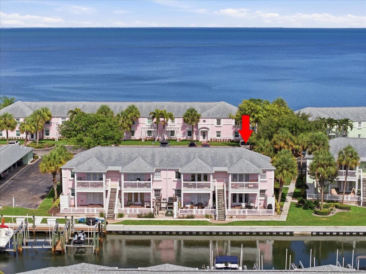 Waterfront Resort Living at Waterside at Coquina Key!

Welcome to your slice of paradise, a beautifully updated **first-floor waterfront end unit** located in the highly sought-after gated community of **Waterside at Coquina Key**. Offering stunning water views, an oversized patio, and an unbeatable resort lifestyle, this condo is the perfect place to call home, escape for the season, or add to your investment portfolio.

As an **end unit**, you'll enjoy a larger patio than most, creating the ideal setting for morning coffee, waterfront dining, or evening cocktails while watching boats glide by and dolphins and manatees play in the water. Fishing enthusiasts will love the ability to cast a line right from behind the building, and sunset lovers will be treated to breathtaking nightly displays of color reflecting across the bay.

The interior has been thoughtfully updated in **2024**, featuring a completely remodeled kitchen with **all-new cabinetry, granite countertops, a new refrigerator, and a new dishwasher**. The bathroom has been beautifully renovated with the removal of the tub and installation of a spacious tiled walk-in shower, along with a new vanity, sink, toilet, and flooring. Additional updates include new flooring in the bedroom and bathroom, plus fresh paint throughout, creating a bright, modern, and move-in-ready living space.

To make your transition effortless, the seller is willing to sell the unit **fully furnished, including patio furniture**, allowing you to immediately begin enjoying the Florida lifestyle or generating rental income.

Whether you're looking for a full-time residence, seasonal retreat, or income-producing investment property, this condo offers incredible flexibility. **A tenant is currently in place through August and is interested in remaining after the current lease ends**, providing immediate rental income potential for investors or a future move-in opportunity for owner-occupants.

Living in **Waterside at Coquina Key** means enjoying one of St. Petersburg's premier waterfront resort communities. Residents enjoy a **24-hour guarded gate**, waterfront yacht club with a lively bar, two swimming pools, heated spa, state-of-the-art fitness center, pickleball courts, tennis courts, volleyball, basketball, shuffleboard, horseshoes, fishing pier, kayak launch, dog park, and golf-cart-friendly streets. The community's active social calendar includes trivia nights, yoga classes, water aerobics, themed parties, Family Feud competitions, and countless opportunities to meet neighbors and enjoy the Florida lifestyle.

Ideally located just minutes from vibrant downtown St. Petersburg, award-winning restaurants, waterfront parks, museums, and entertainment, with the Gulf beaches approximately 20 minutes away and Tampa International Airport about 30 minutes away.

Why vacation when you can live where every day feels like one? Come experience the waterfront views, resort amenities, and unmatched lifestyle that make Waterside at Coquina Key one of Tampa Bay's most desirable communities.